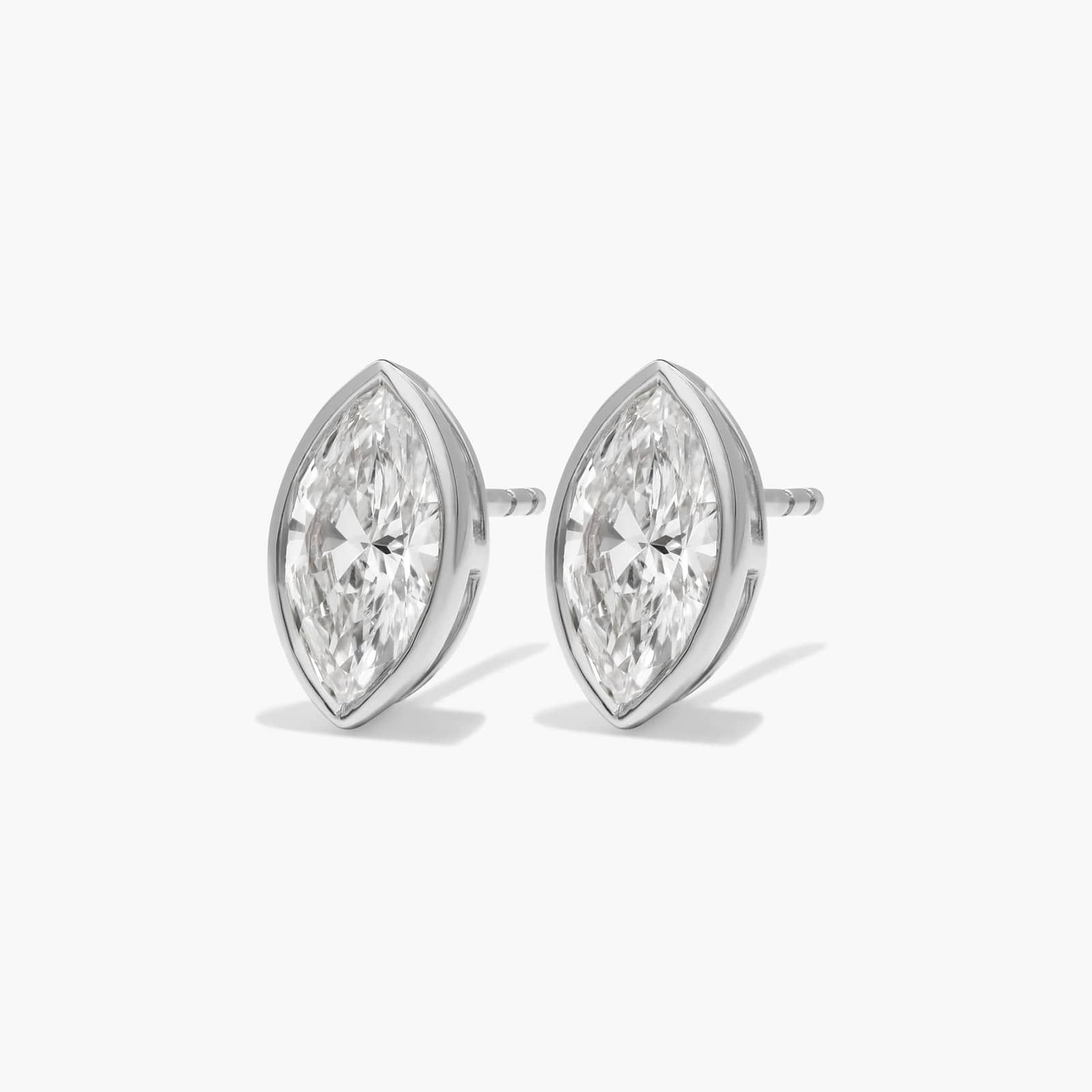 Bezel Diamond Stud Earrings With 2 CTW Marquise Cut Diamonds in Platinum