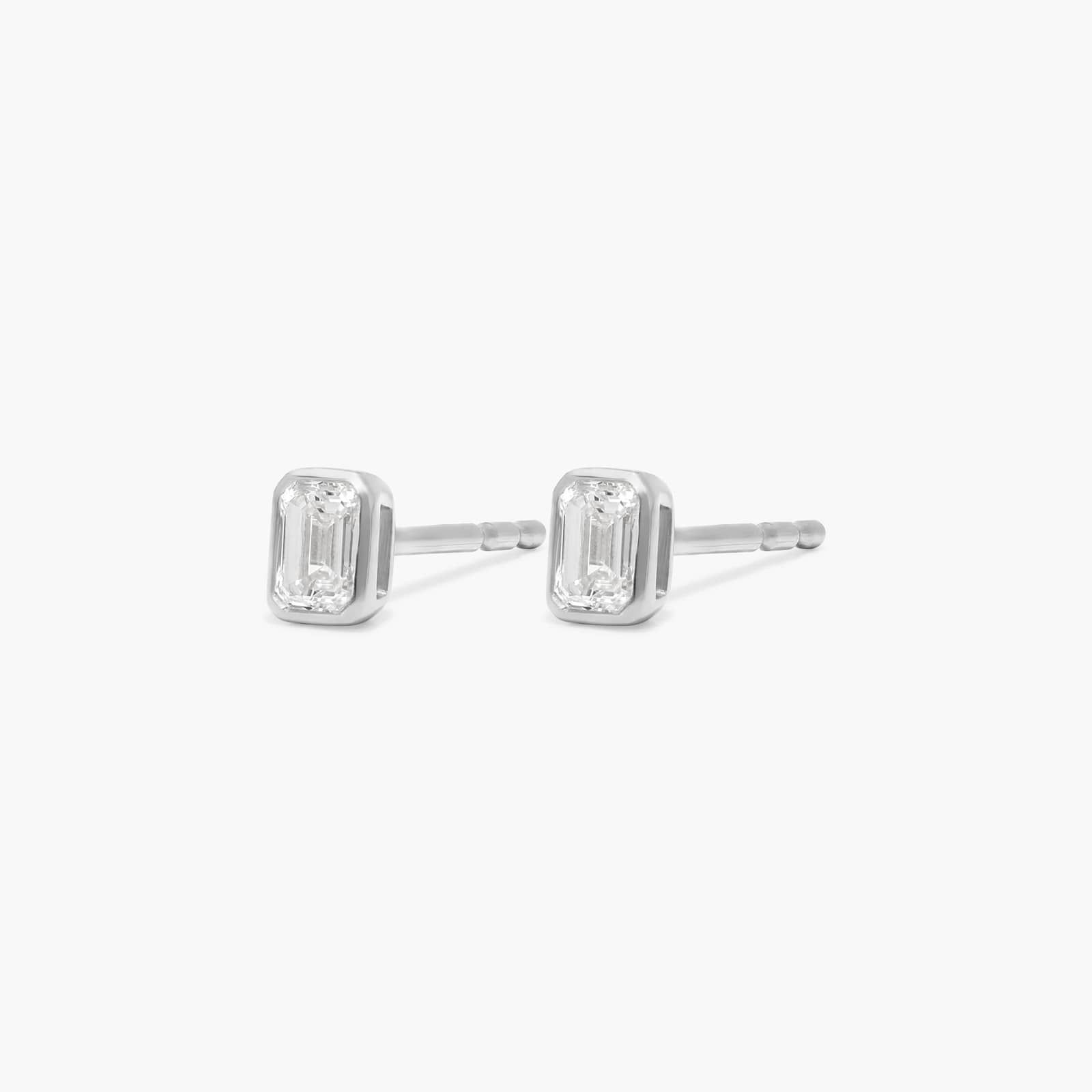 Bezel Diamond Stud Earrings With 0.25 CTW Emerald Cut Diamonds in Platinum