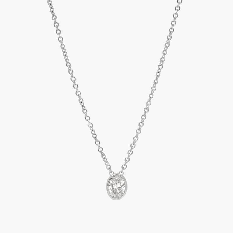 Bezel Solitaire Pendant Necklace With 0.25 CTW Oval Cut Diamond in Platinum