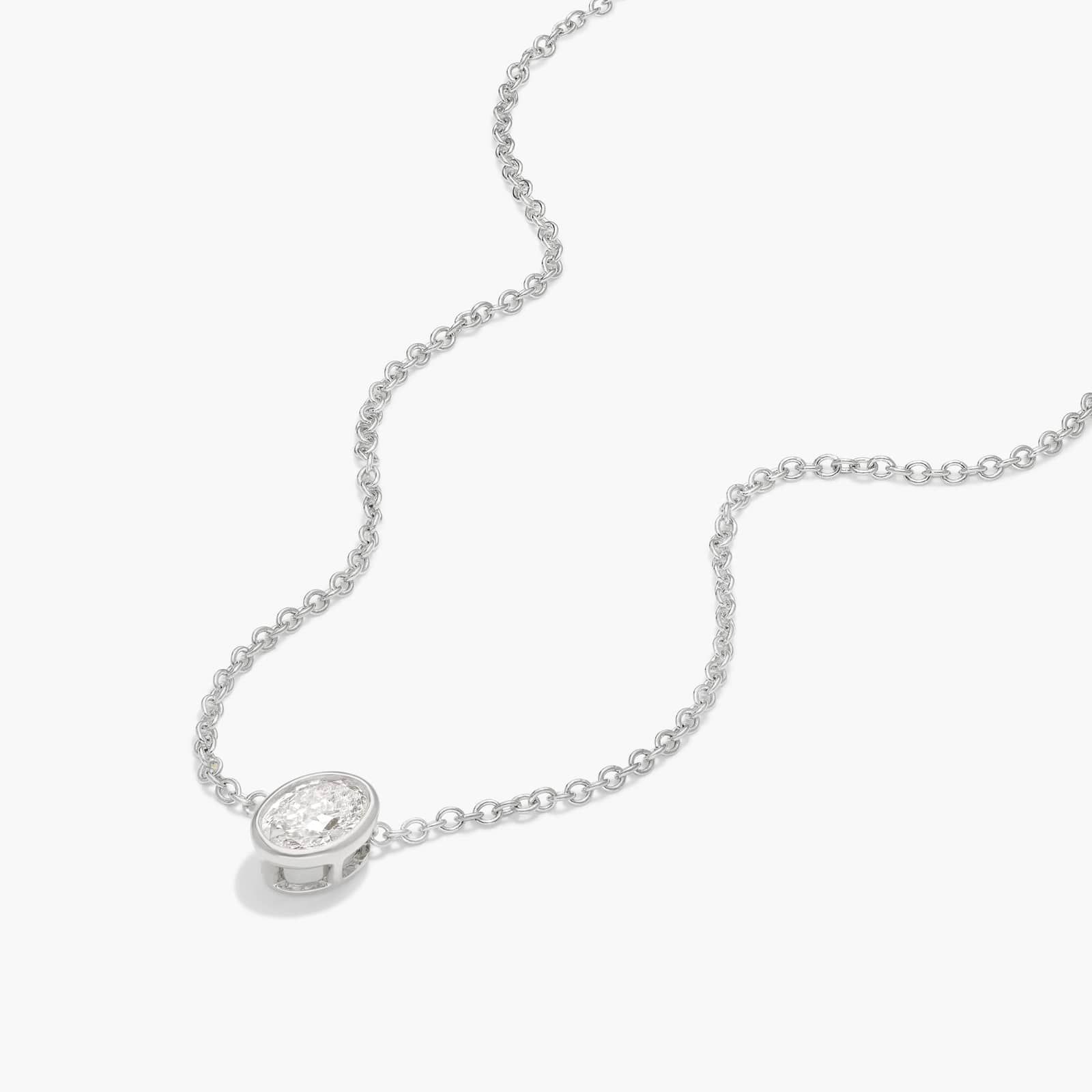 Bezel Solitaire Pendant Necklace With 0.25 CTW Oval Cut Diamond in Platinum