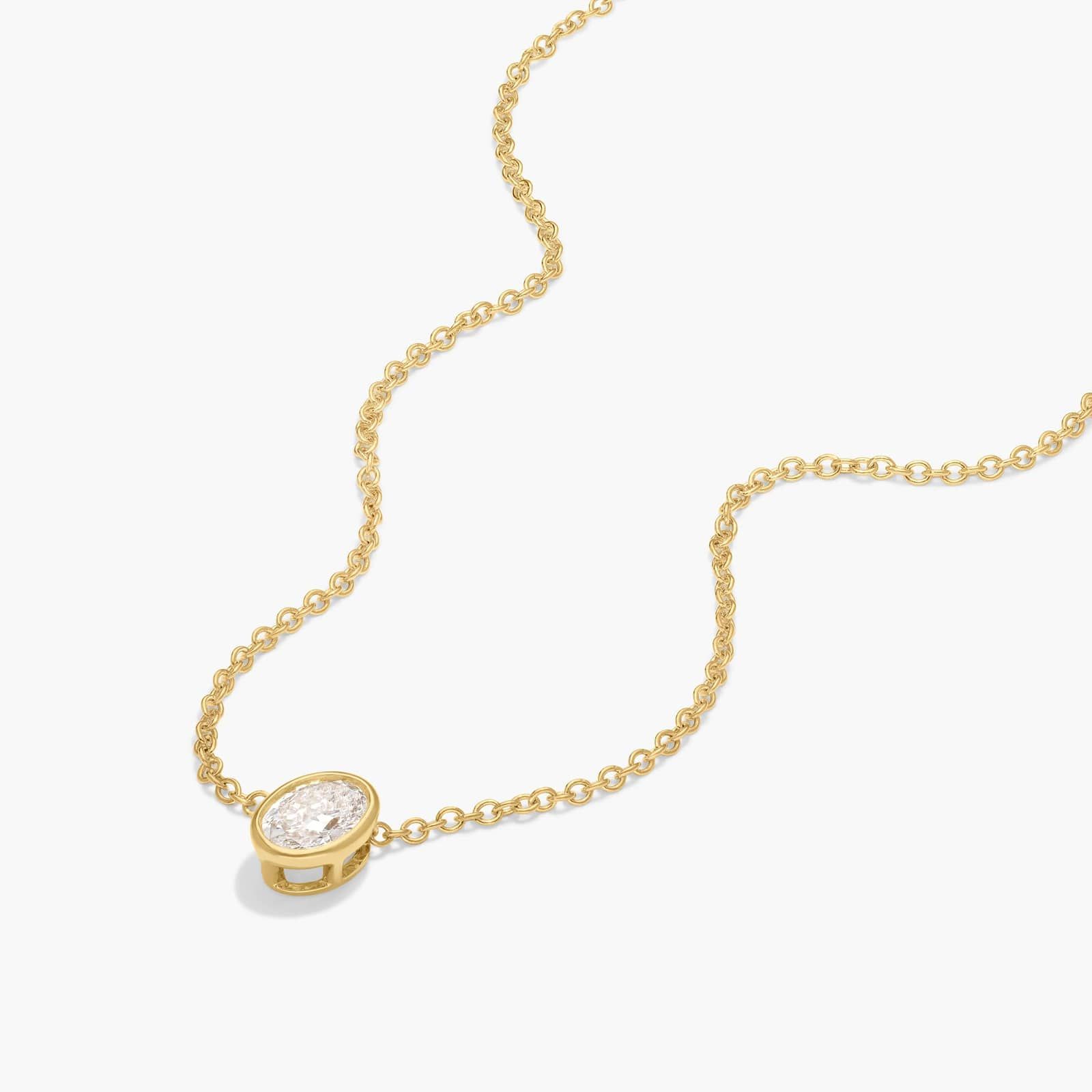 Bezel Solitaire Pendant Necklace With 0.25 CTW Oval Cut Diamond in 14K Yellow Gold