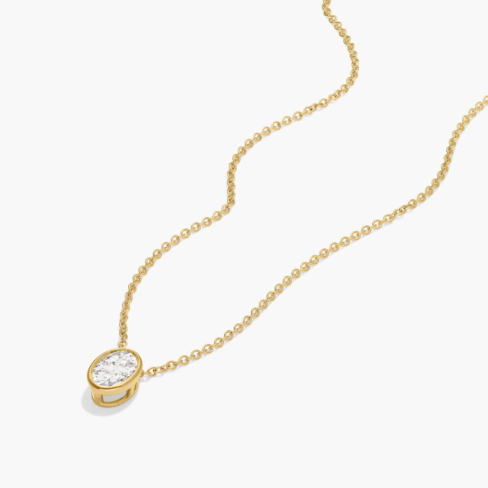 Bezel Solitaire Pendant Necklace With 0.5 CTW Oval Cut Diamond in 14K Yellow Gold