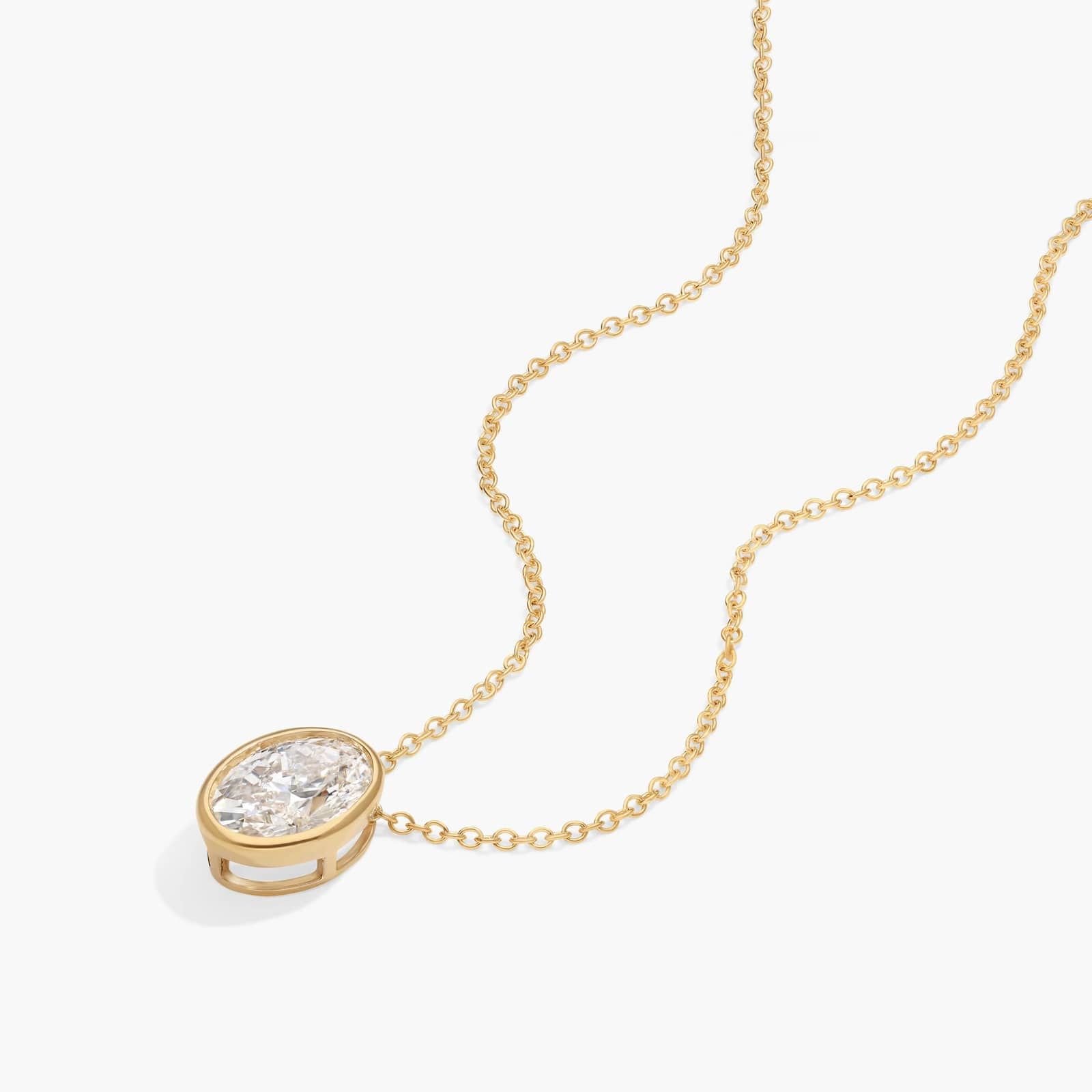 Bezel Solitaire Pendant Necklace With 1.5 CTW Oval Cut Lab-Grown Diamond in 14K Yellow Gold