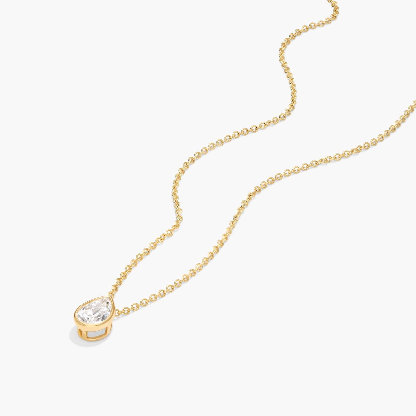 Bezel Solitaire Pendant Necklace With 0.5 CTW Pear Shaped Diamond in 14K Yellow Gold