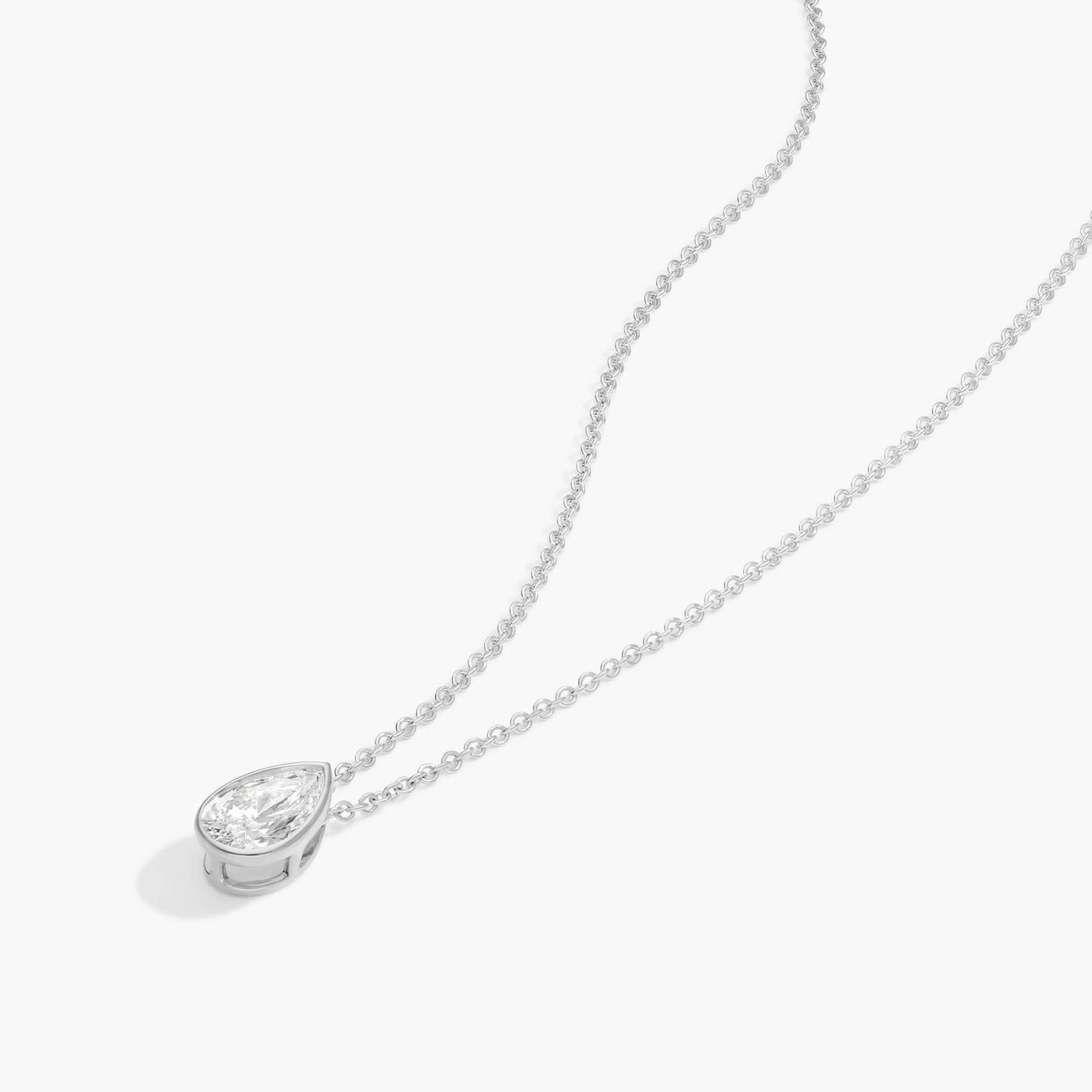Bezel Solitaire Pendant Necklace With 0.75 CTW Pear Shaped Diamond in Platinum