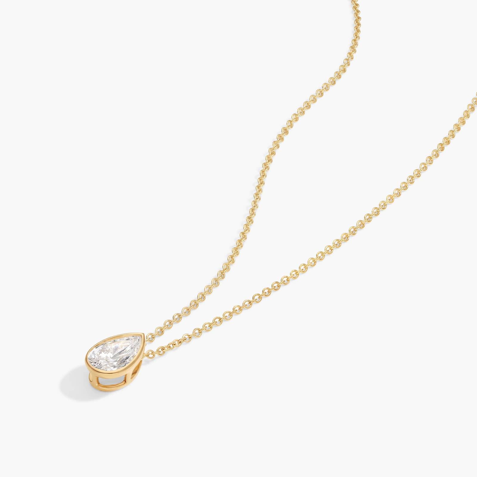 Bezel Solitaire Pendant Necklace With 0.75 CTW Pear Shaped Diamond in 14K Yellow Gold