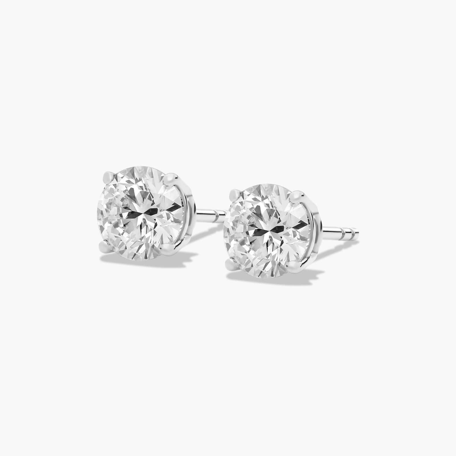 Platinum Four Prong Round Brilliant Diamond Stud Earrings (1.50 CTW - F-G / VS1-VS2)