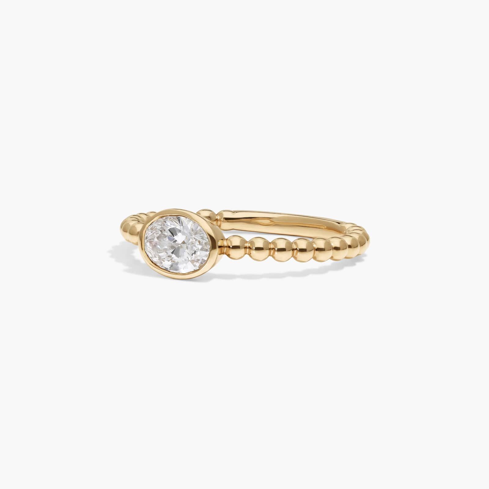East-West Bezel Beaded Ring With 0.5 CTW Oval Cut Lab-Grown Diamond in 14K Yellow Gold