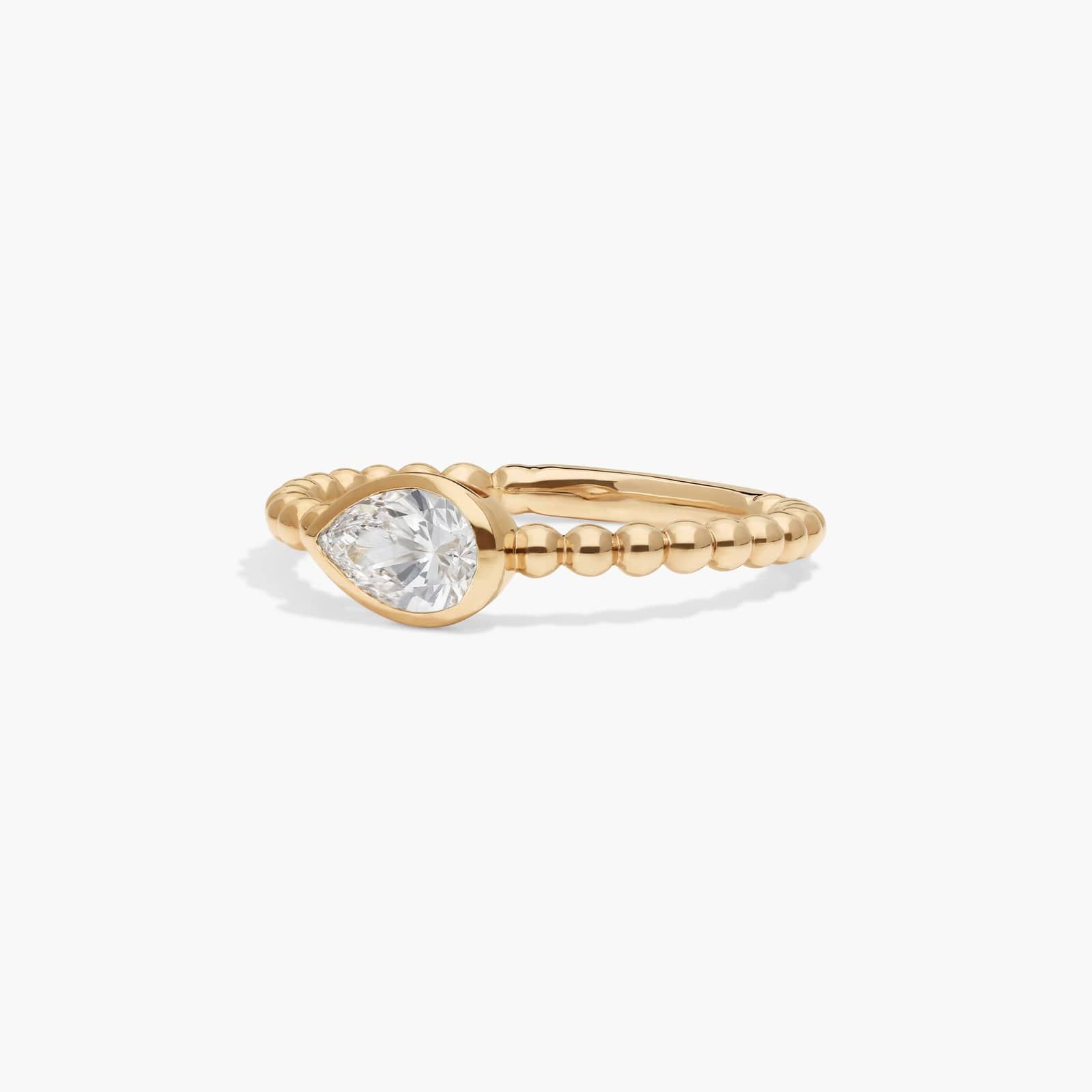 East-West Bezel Beaded Ring With 0.5 CTW Pear Shaped Lab-Grown Diamond in 14K Yellow Gold