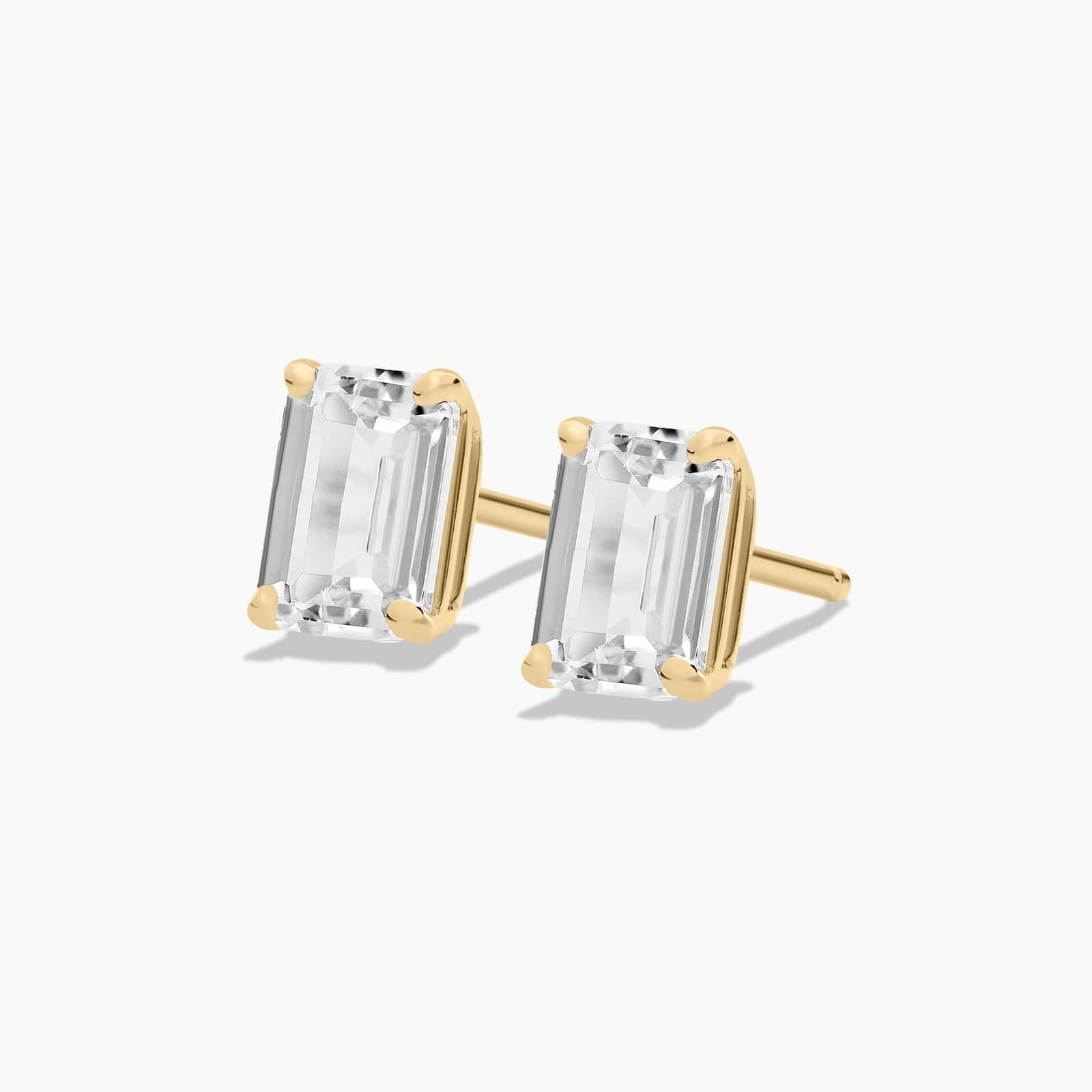 Emerald Cut White Topaz Birthstone Stud Earrings In 14K Yellow Gold