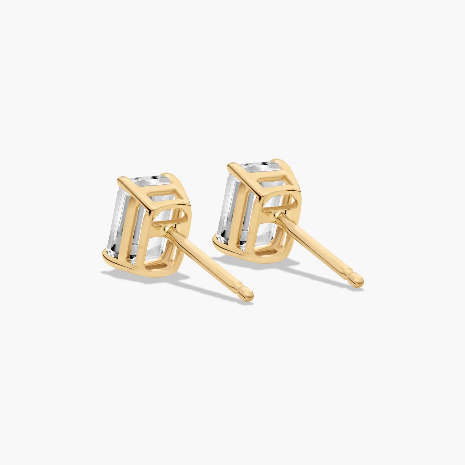 Emerald Cut White Topaz Birthstone Stud Earrings In 14K Yellow Gold