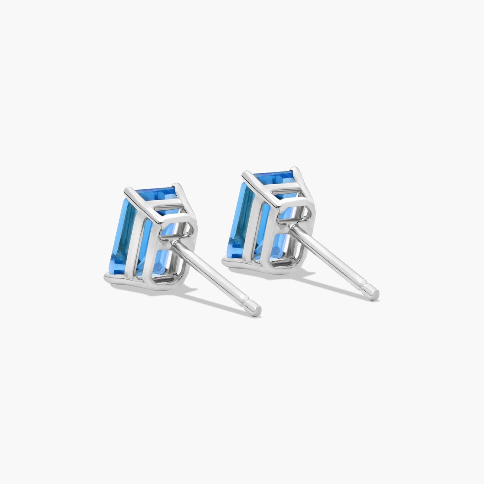 Emerald Cut Swiss Blue Topaz Birthstone Stud Earrings In 14K White Gold