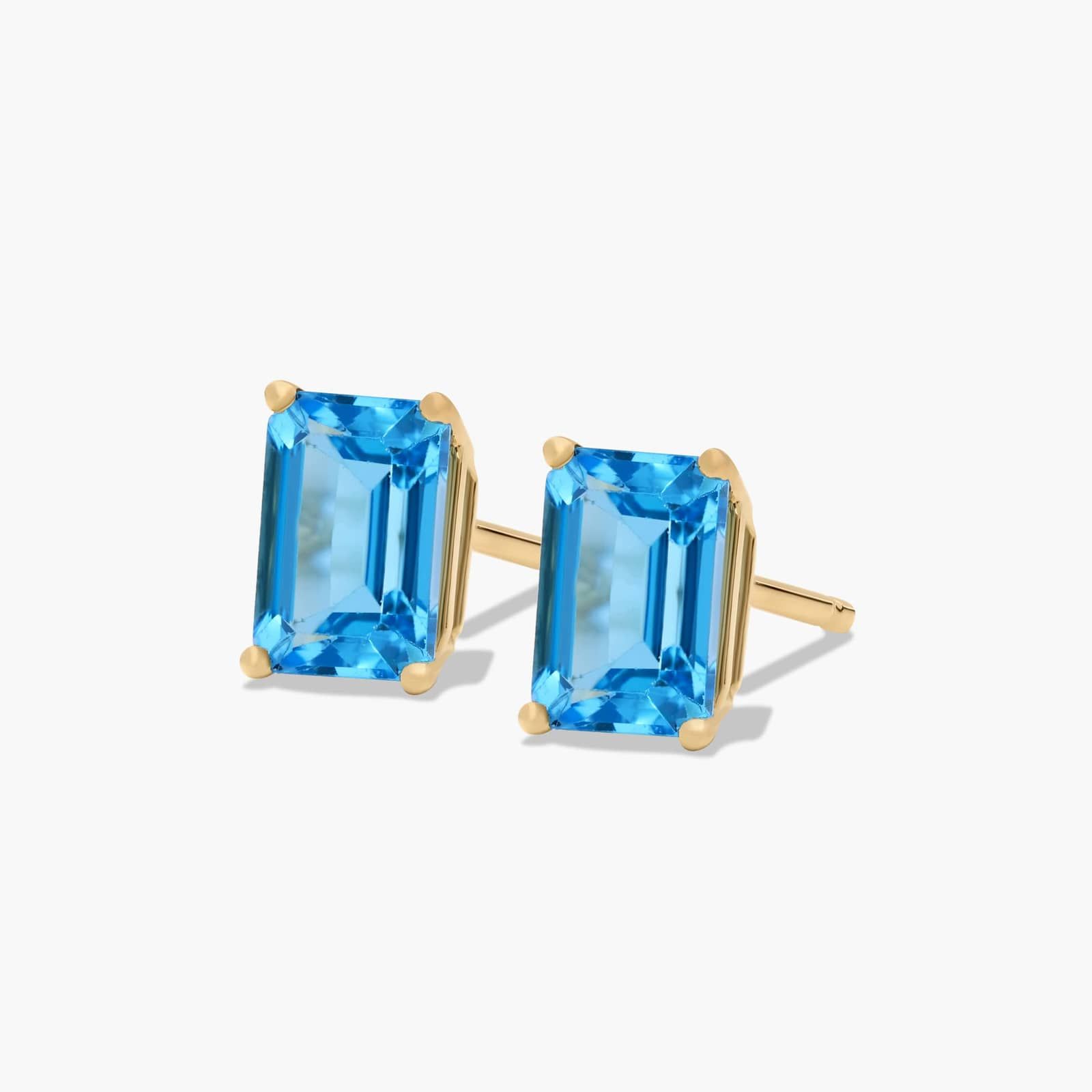 Emerald Cut Swiss Blue Topaz Birthstone Stud Earrings In 14K Yellow Gold