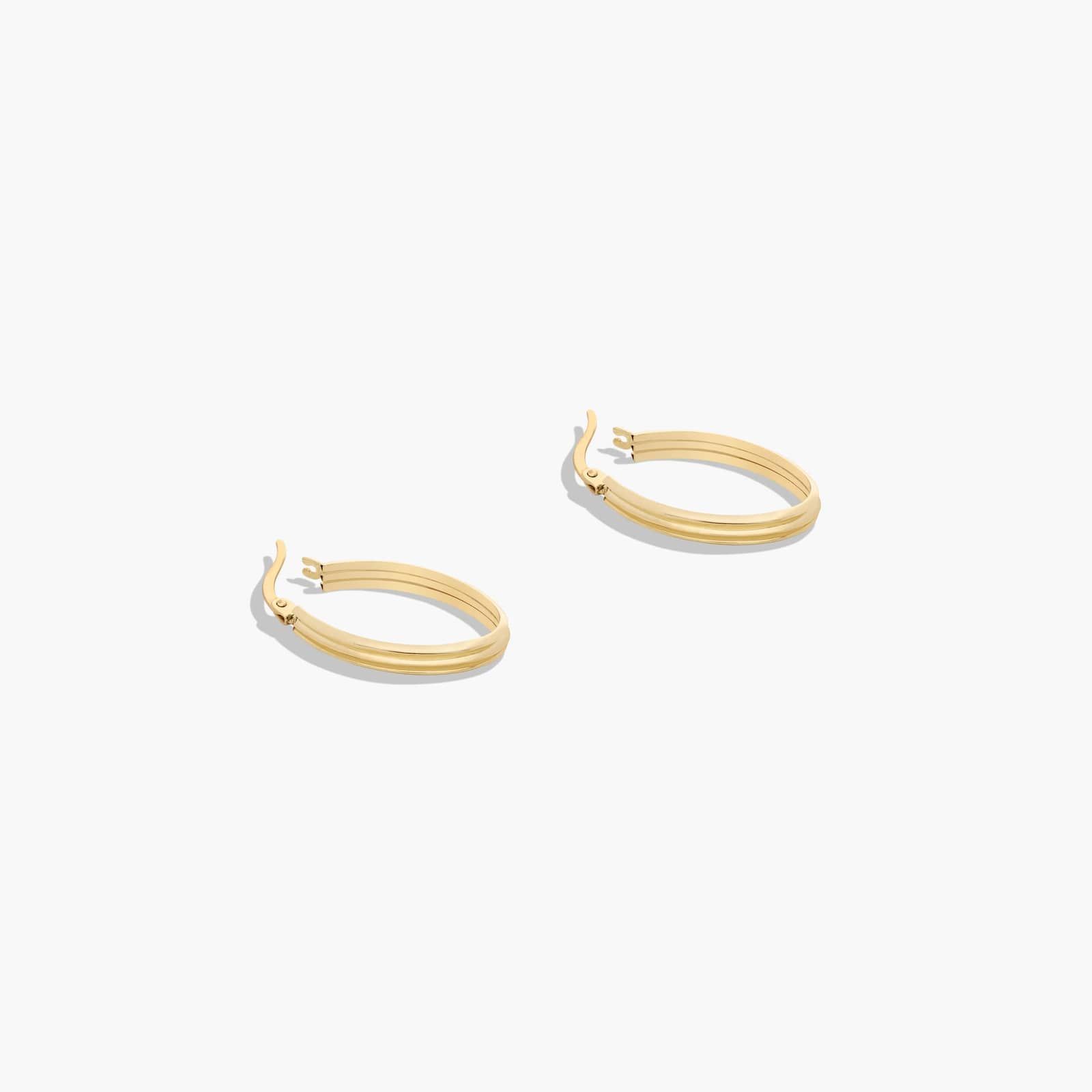 Golden Hour Grooved Oval Hoop Earrings In 14K Yellow Gold