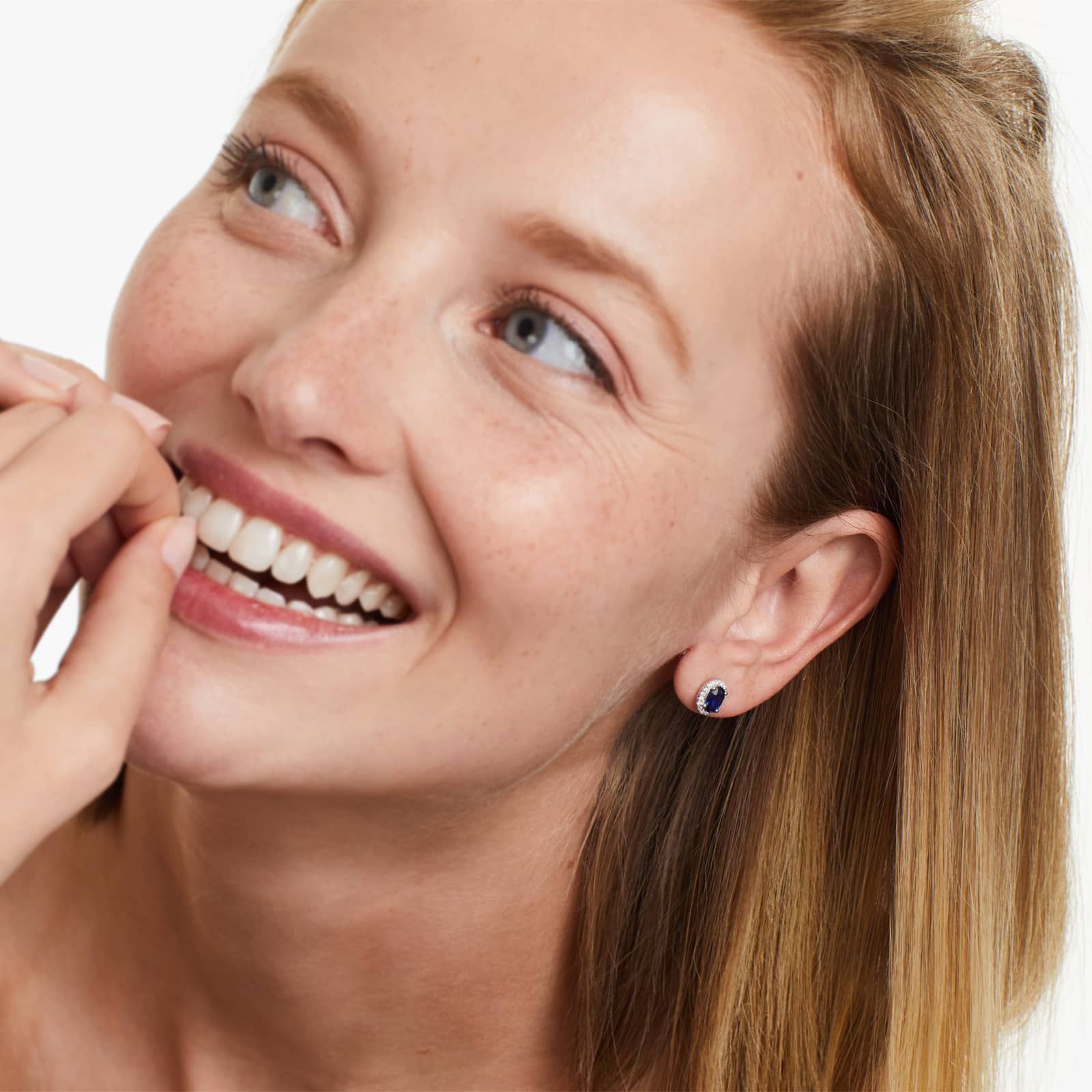 Oval Cut Sapphire And Diamond Halo Earrings In 18K White Gold