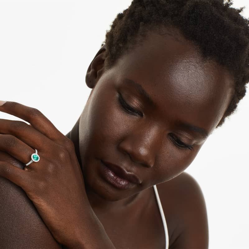 Oval Halo Emerald And Diamond Ring In 18K White Gold