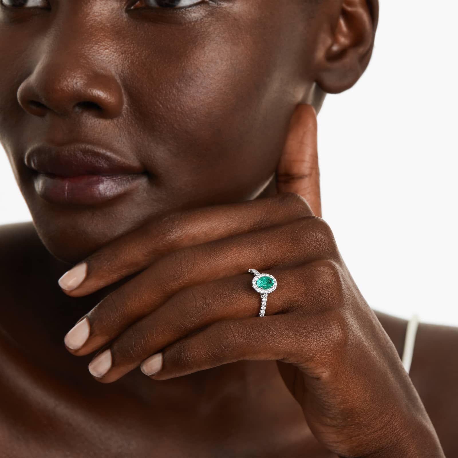 Oval Halo Emerald And Diamond Ring In 18K White Gold