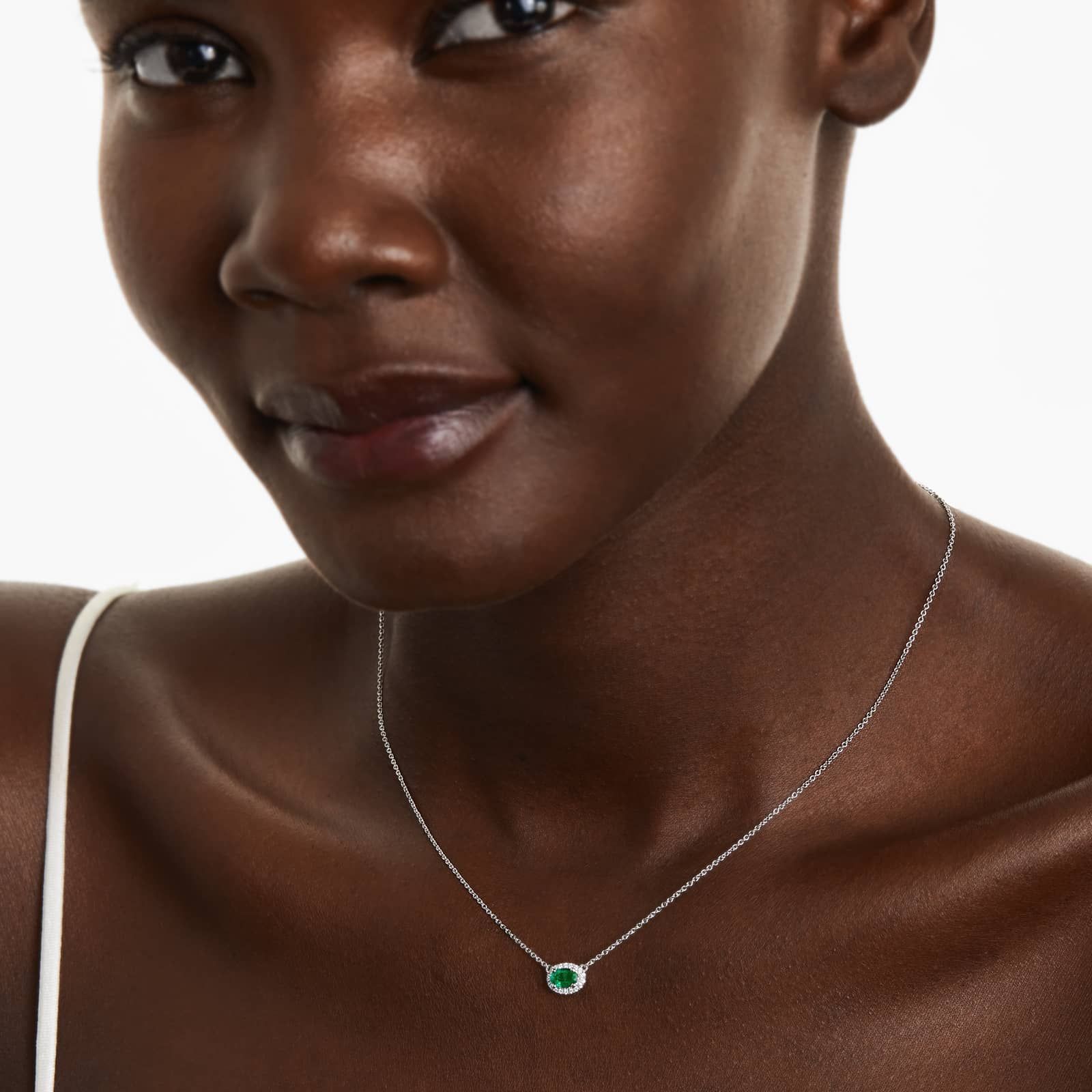 18K White Gold East West Set Oval Halo Emerald and Diamond Necklace (6.0x4.0mm)