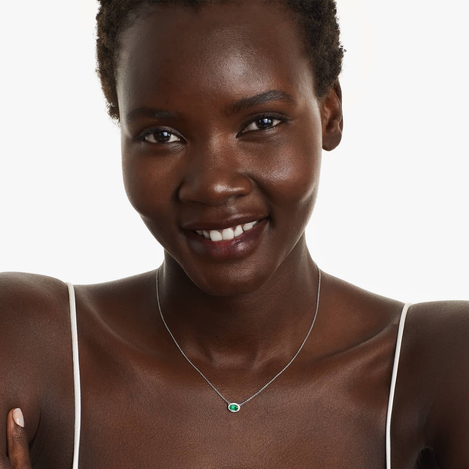 18K White Gold East West Set Oval Halo Emerald and Diamond Necklace (6.0x4.0mm)