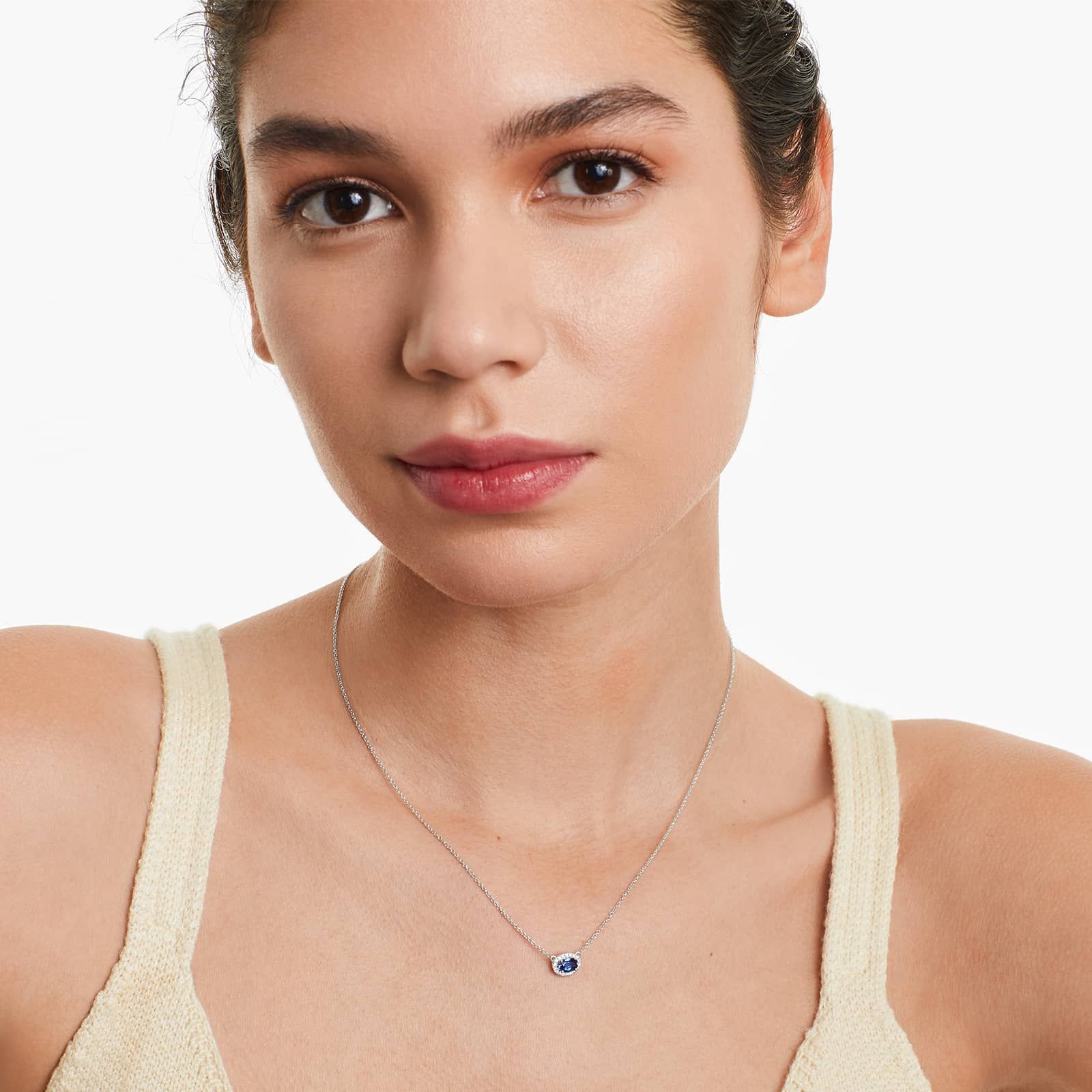 18K White Gold East West Set Oval Halo Sapphire and Diamond Necklace (6.0x4.0mm)