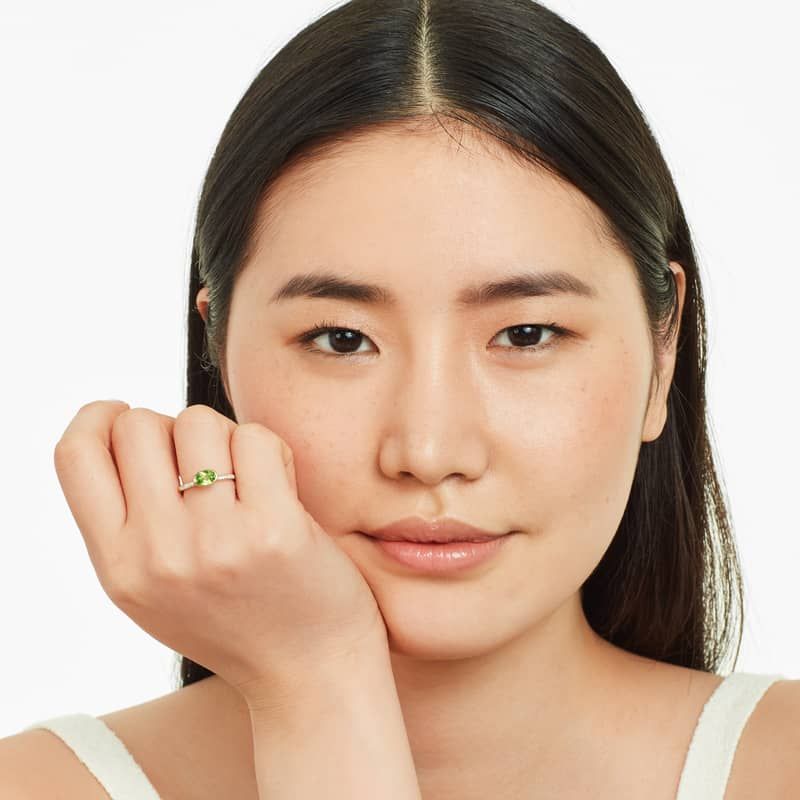 East-West Oval Peridot And Diamond Ring In 18K Yellow Gold
