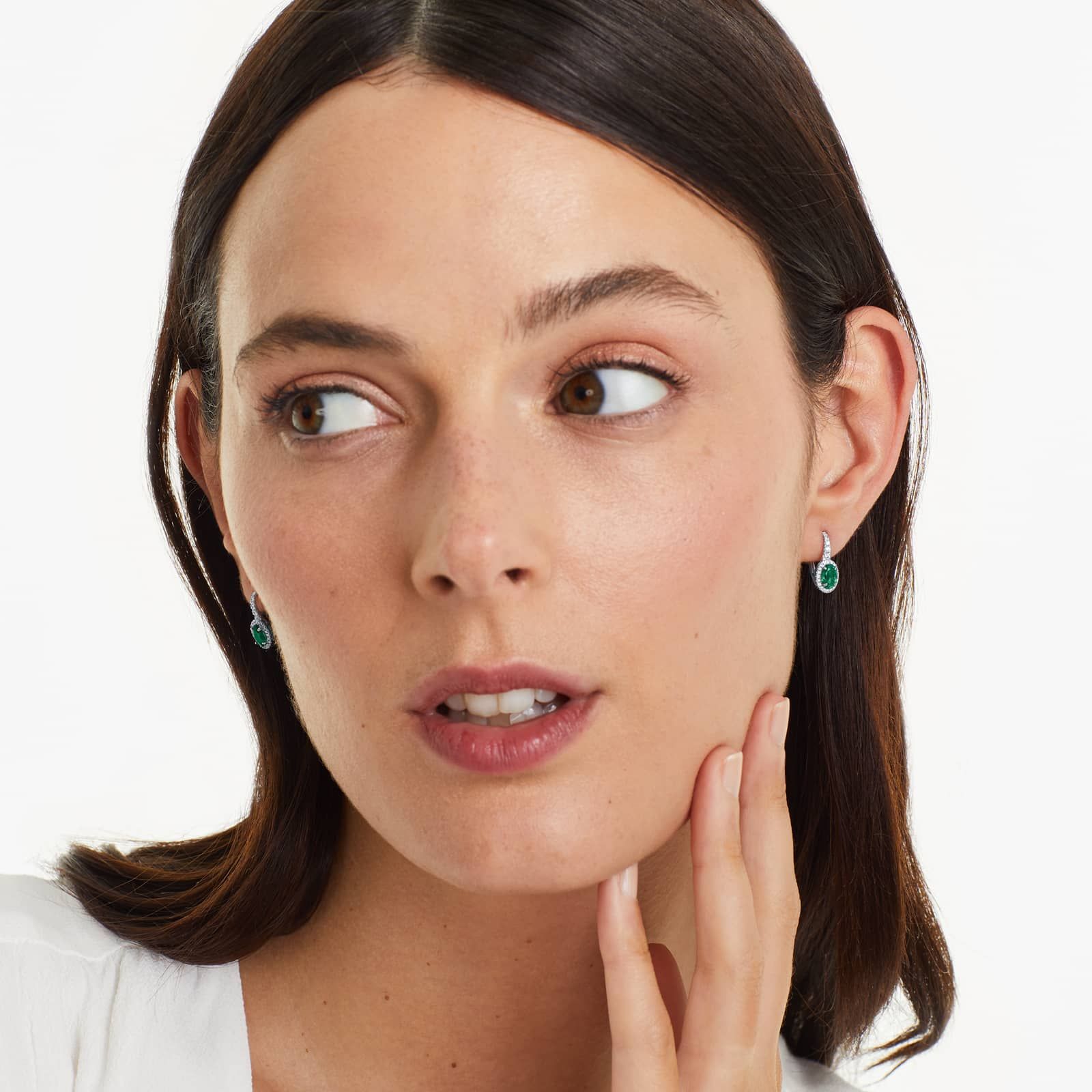 Petite Oval Cut Emerald And Diamond Halo Drop Earrings In 18K White Gold