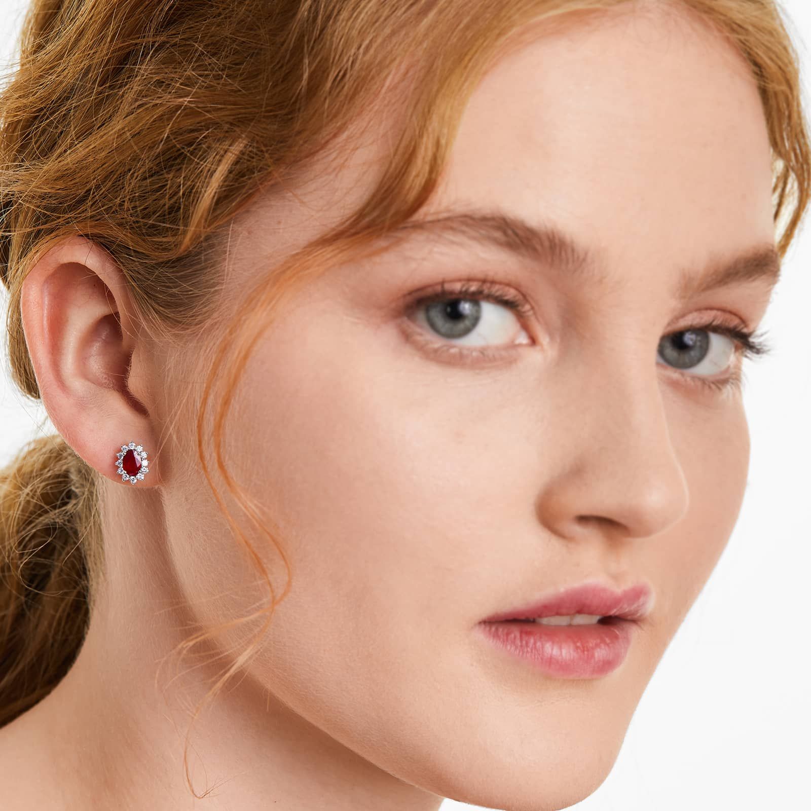 Oval Cut Ruby And Diamond Halo Earrings In 18K White Gold