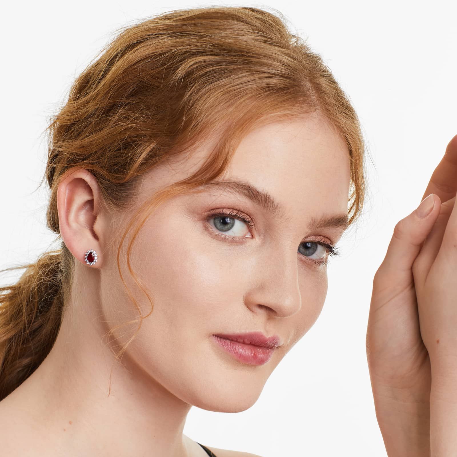 Oval Cut Ruby And Diamond Halo Earrings In 18K White Gold