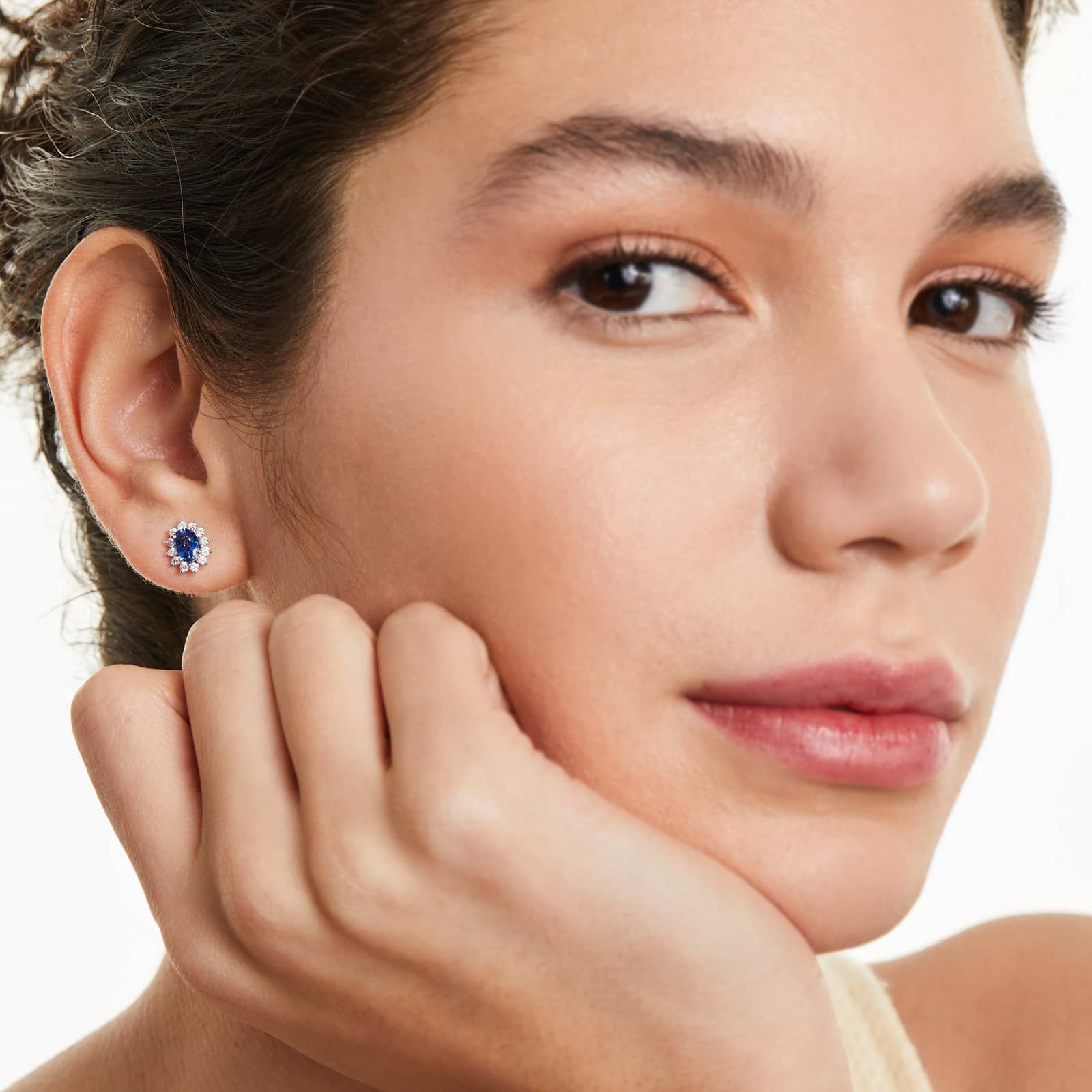 Oval Cut Sapphire And Diamond Halo Earrings In 18K White Gold