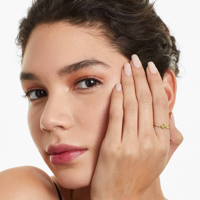 Dainty Peridot Bezel Diamond Ring In 14K Yellow Gold by Brevani