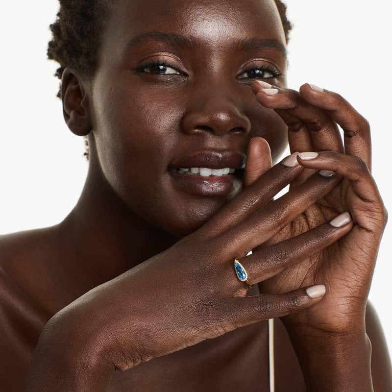 Teardrop Blue Topaz And Diamond Halo Ring In 14K Yellow Gold by Brevani