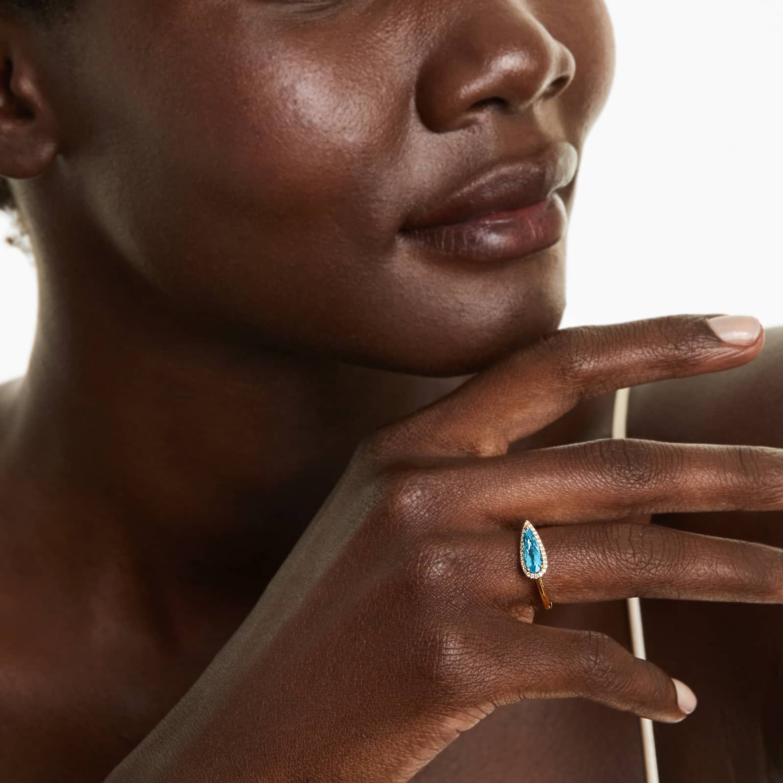 Teardrop Blue Topaz And Diamond Halo Ring In 14K Yellow Gold by Brevani