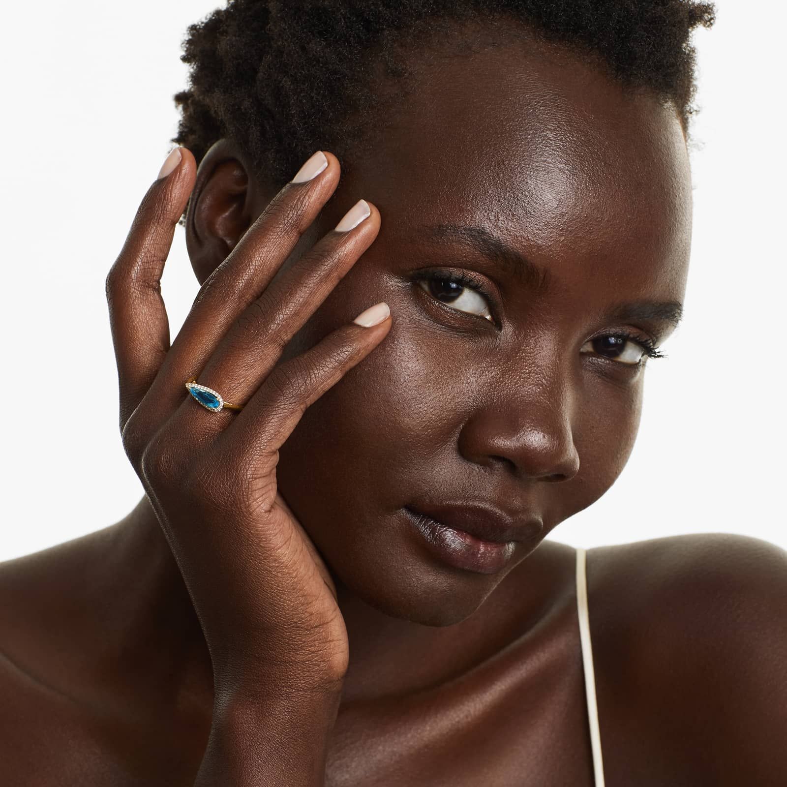 Teardrop Blue Topaz And Diamond Halo Ring In 14K Yellow Gold by Brevani