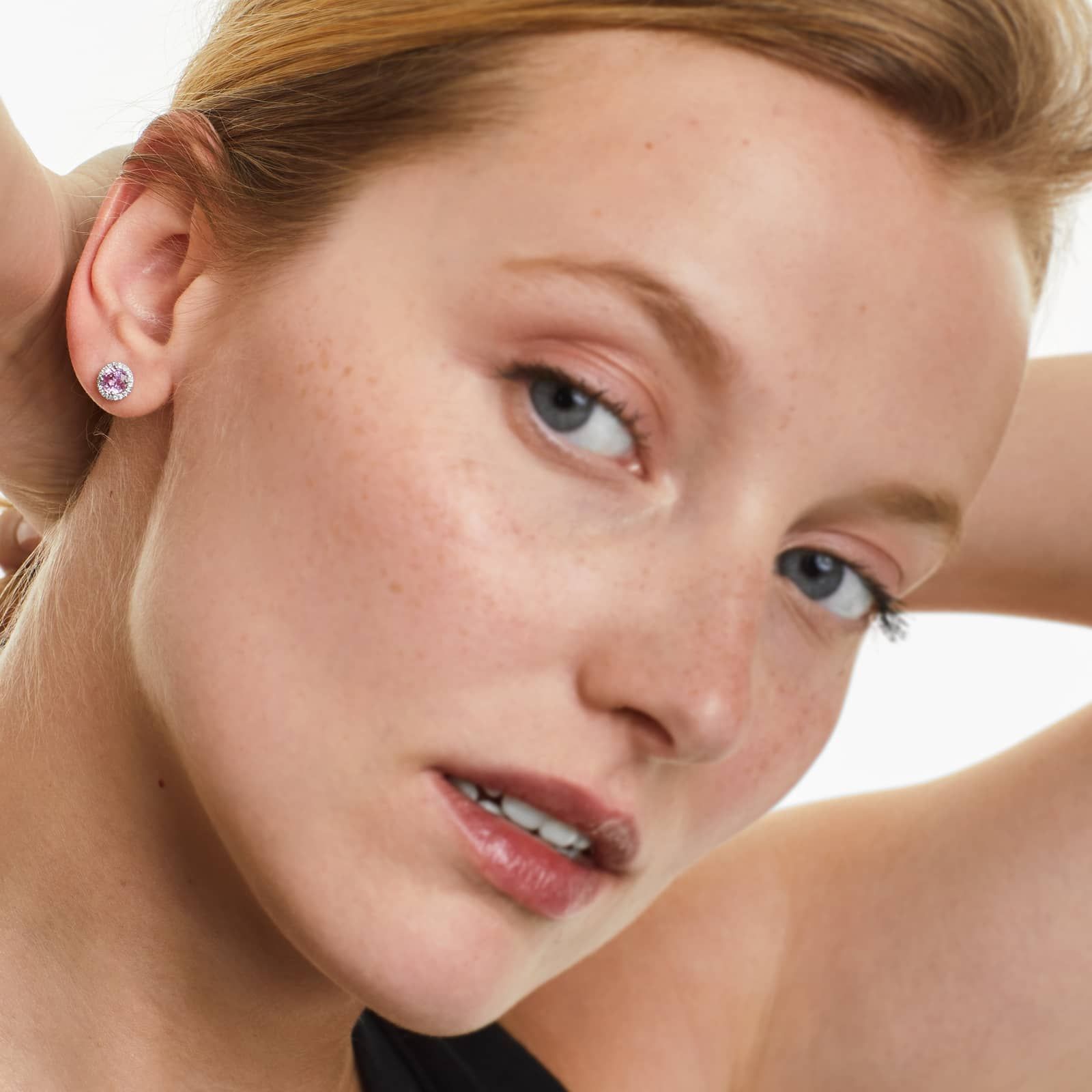 Round Pink Sapphire And Diamond Halo Earrings In 18K White Gold