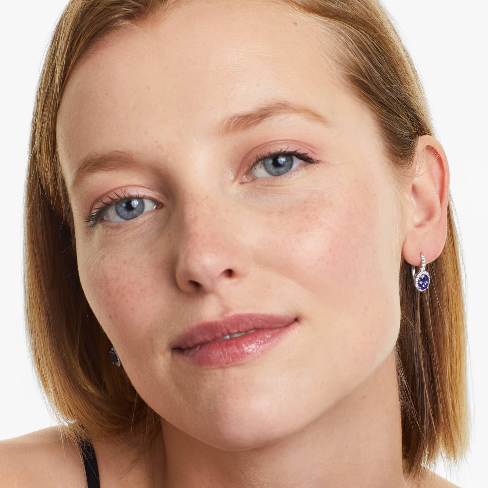 Oval Cut Tanzanite And Diamond Halo Drop Earrings In 14K White Gold