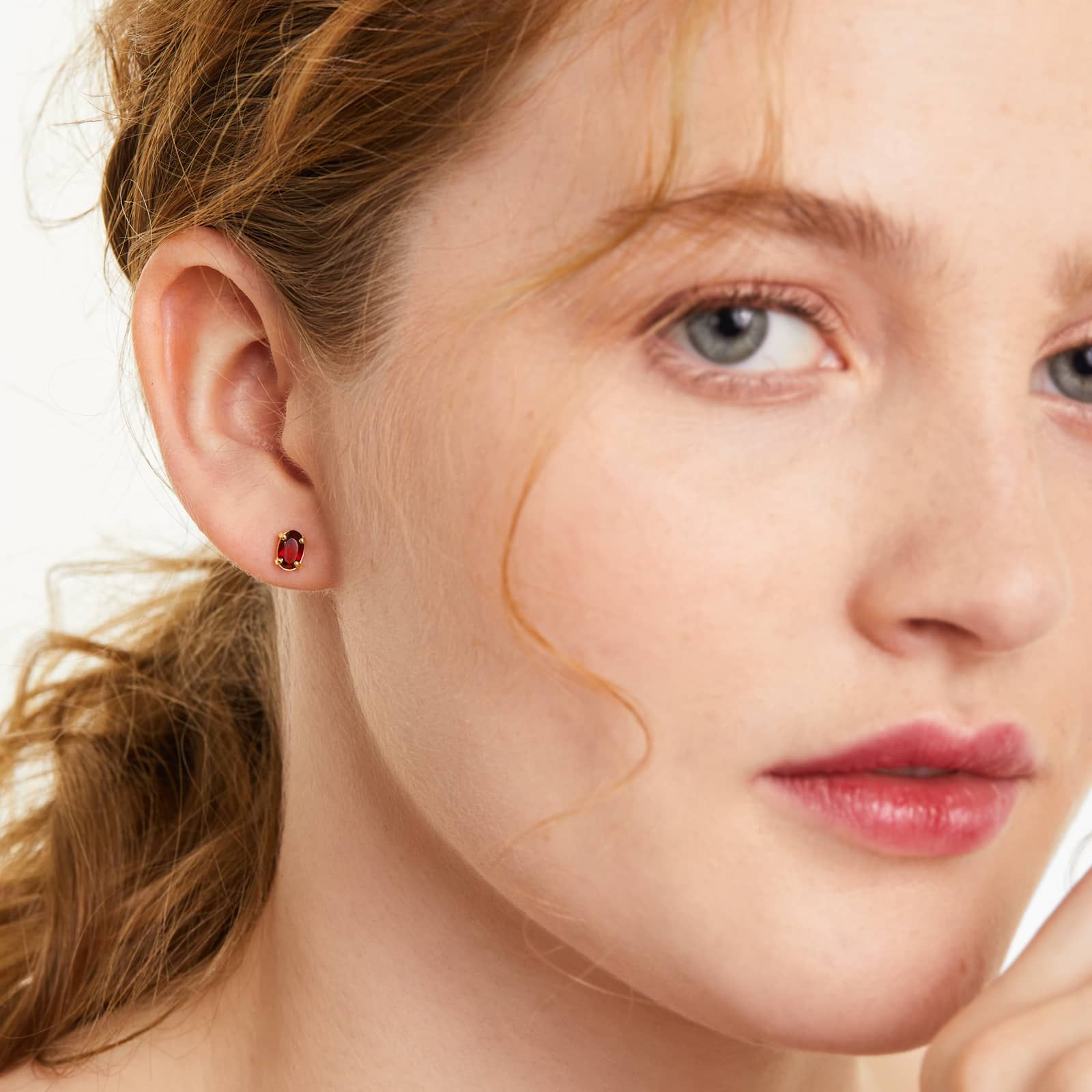 Oval Cut Garnet Birthstone Earrings In 14K Yellow Gold