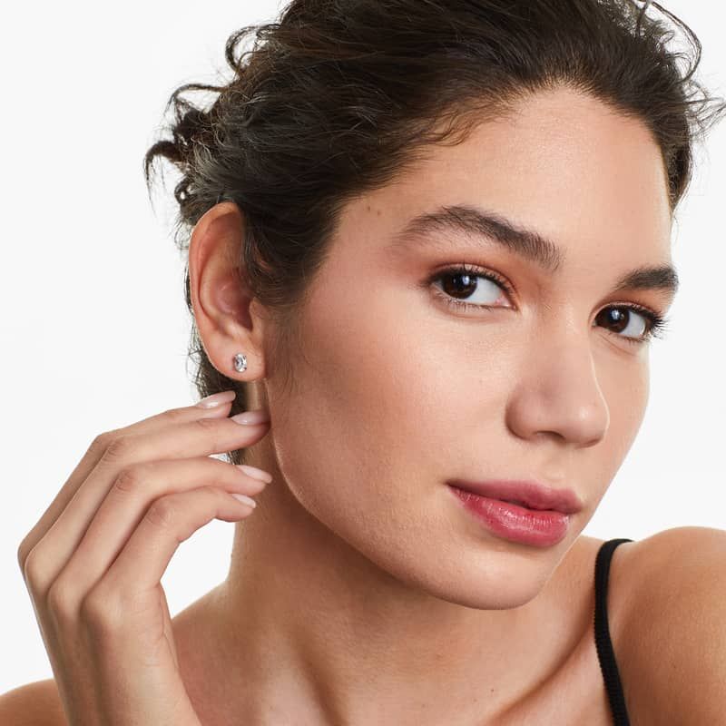 Oval Cut White Topaz Birthstone Earrings In 14K White Gold