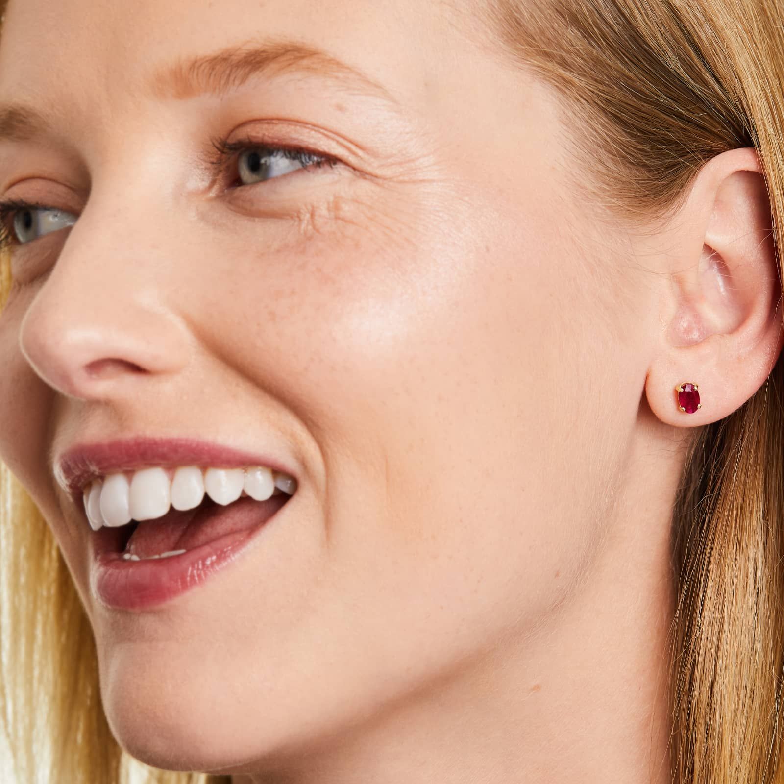 Oval Cut Ruby Birthstone Earrings In 14K Yellow Gold