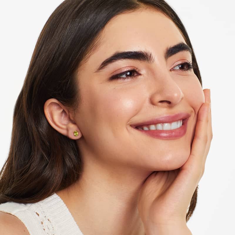 Oval Cut Peridot Birthstone Earrings In 14K Yellow Gold