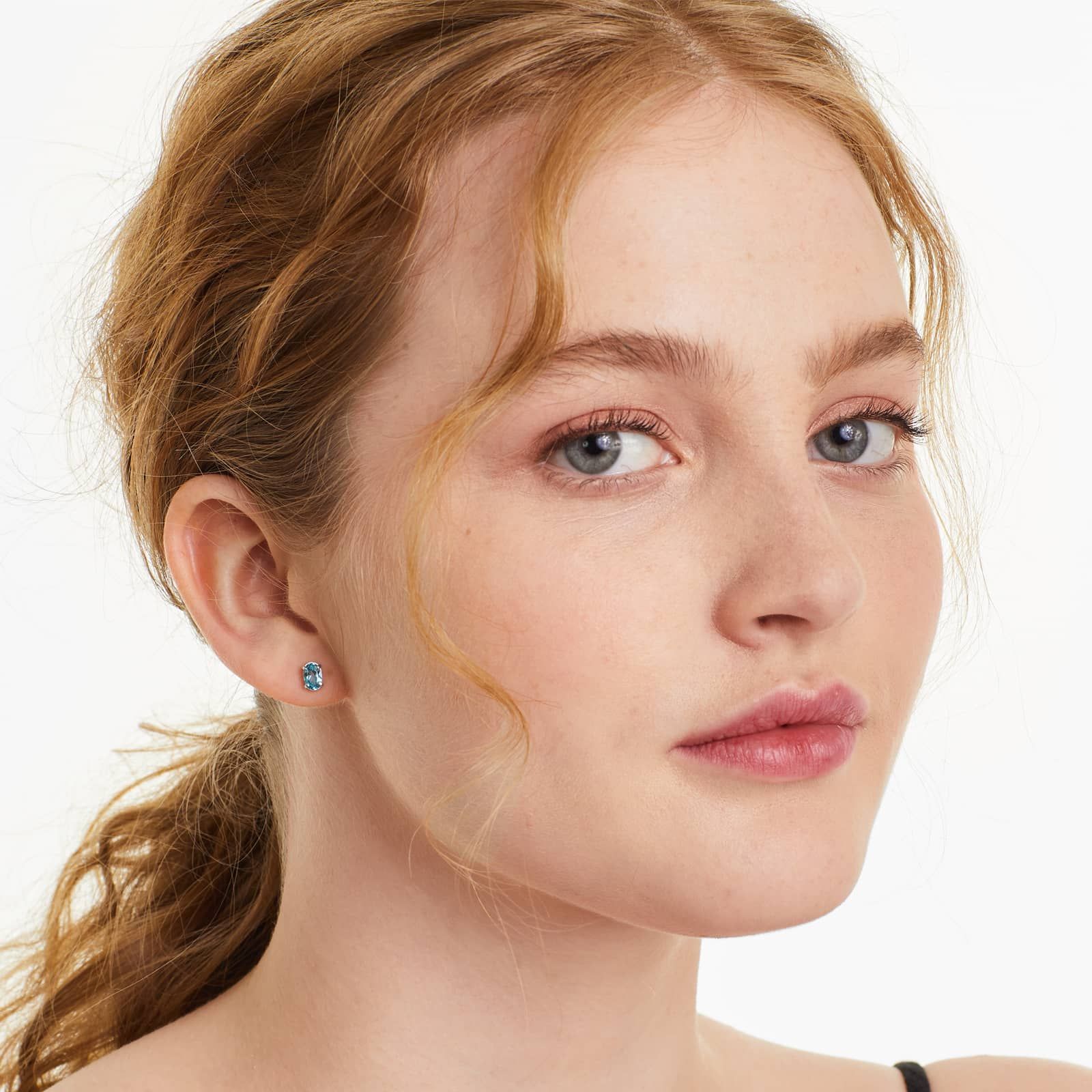 Oval Cut Blue Topaz Birthstone Earrings In 14K White Gold