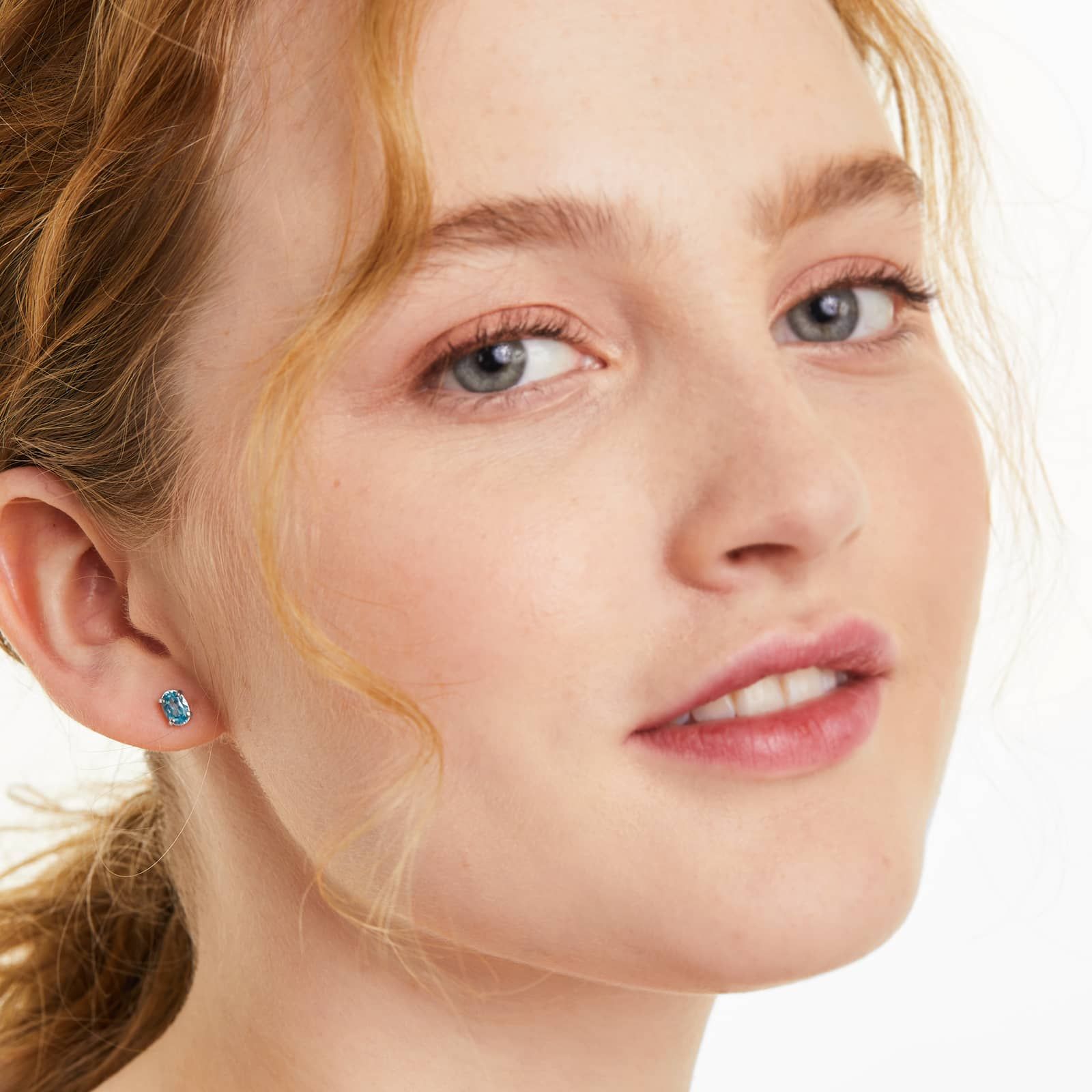 Oval Cut Blue Topaz Birthstone Earrings In 14K White Gold