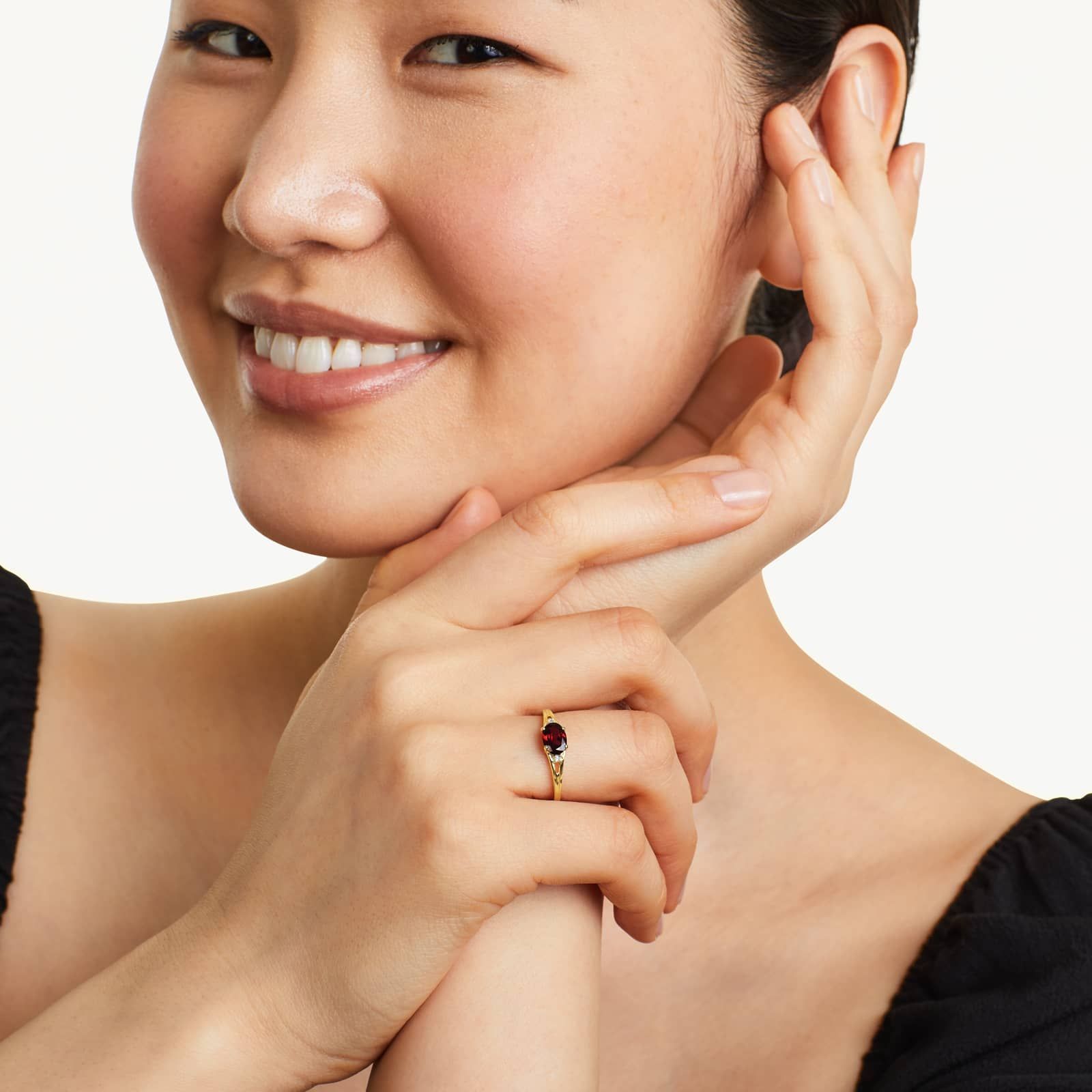 Oval Garnet And Diamond Accent Birthstone Ring In 14K Yellow Gold