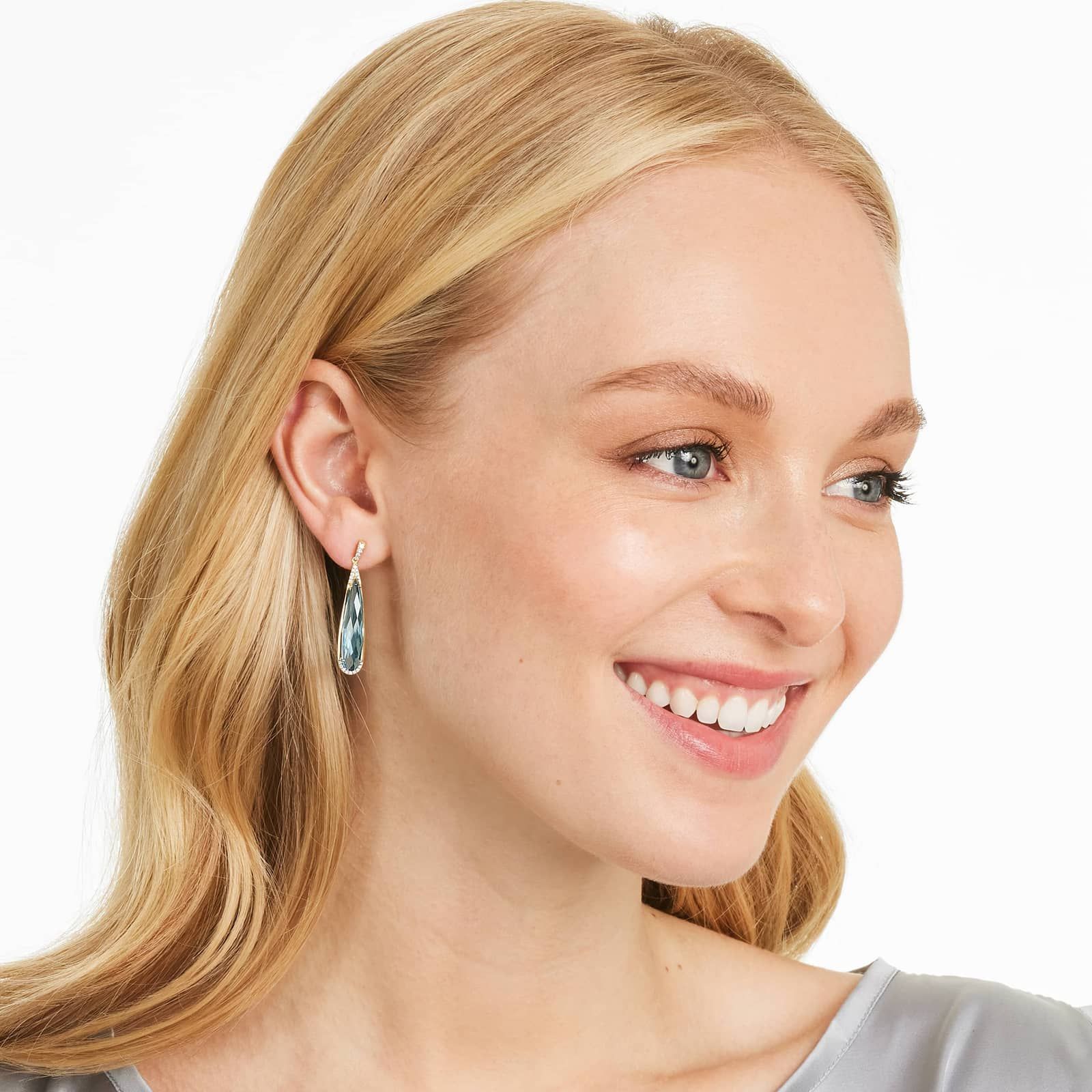 Elongated Pear Shape Blue Topaz Earrings In 14K Yellow Gold