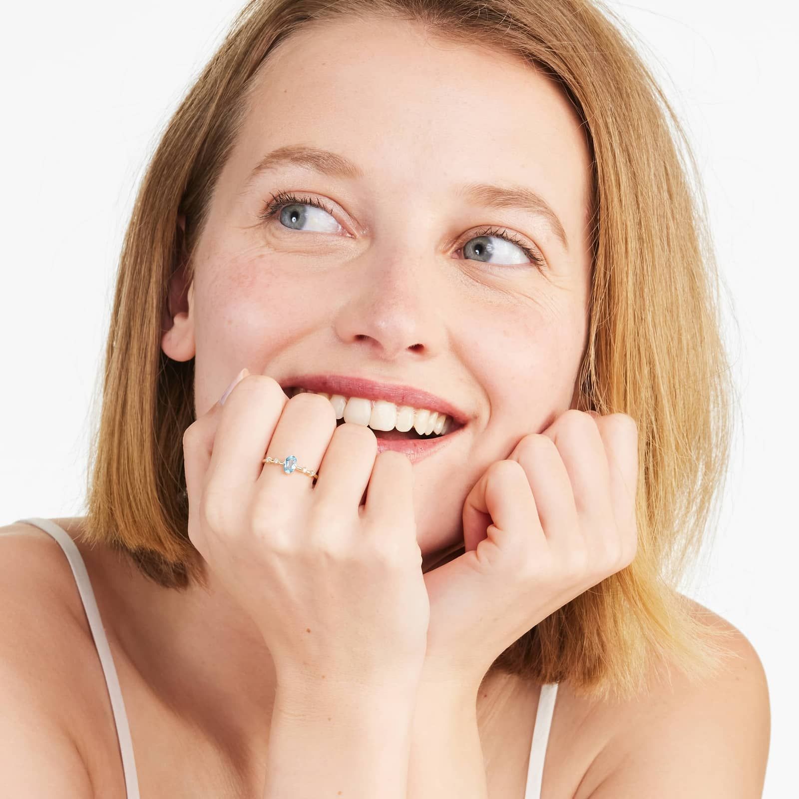 Oval Blue Topaz And Diamond Birthstone Ring In 14K Yellow Gold