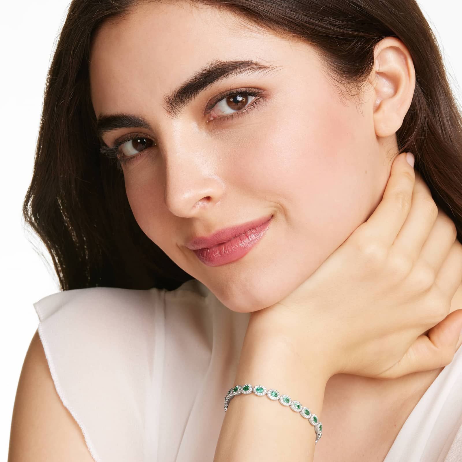 Oval Cut Emerald And Diamond Halo Bracelet In 14K White Gold