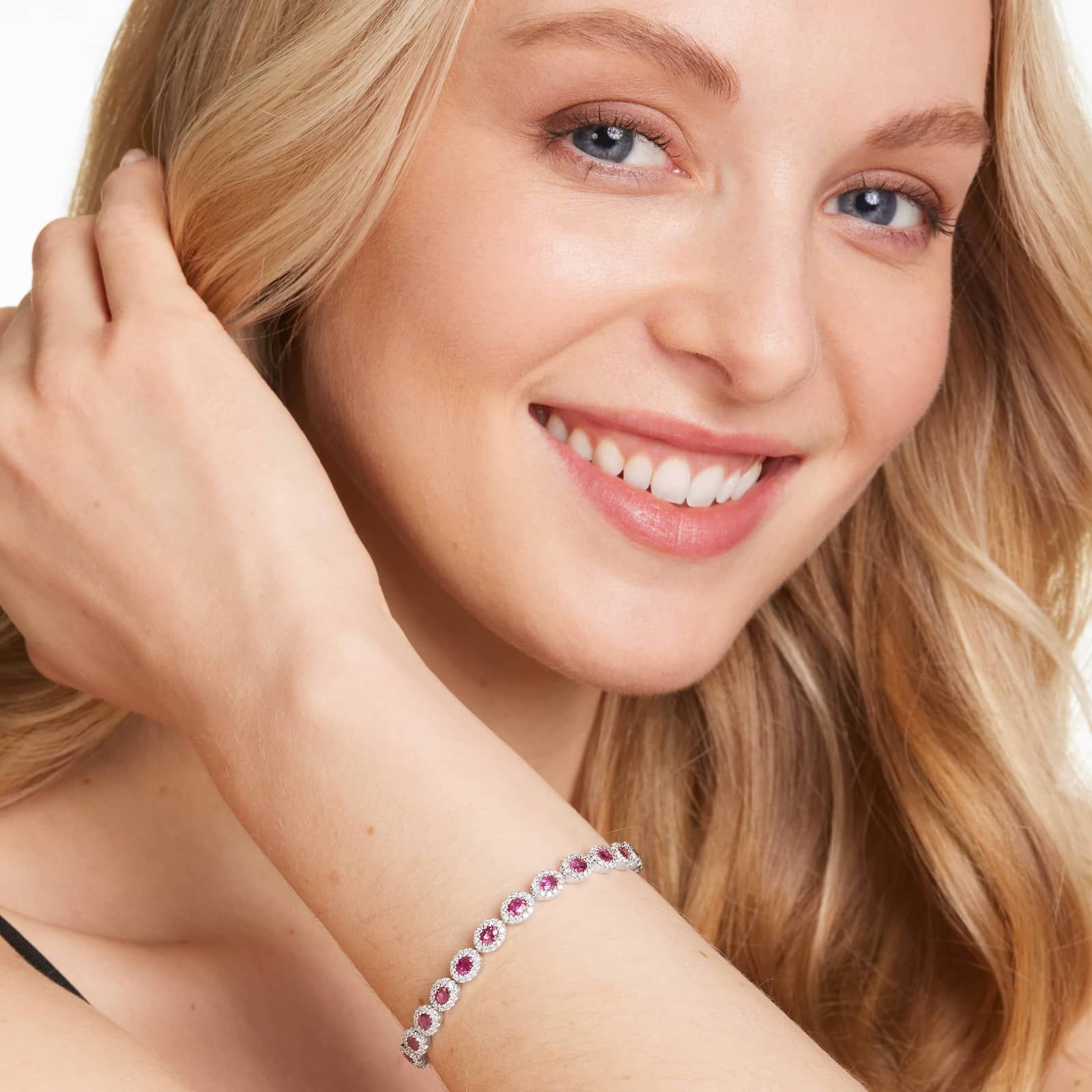 Oval Cut Ruby And Diamond Halo Bracelet In 14K White Gold