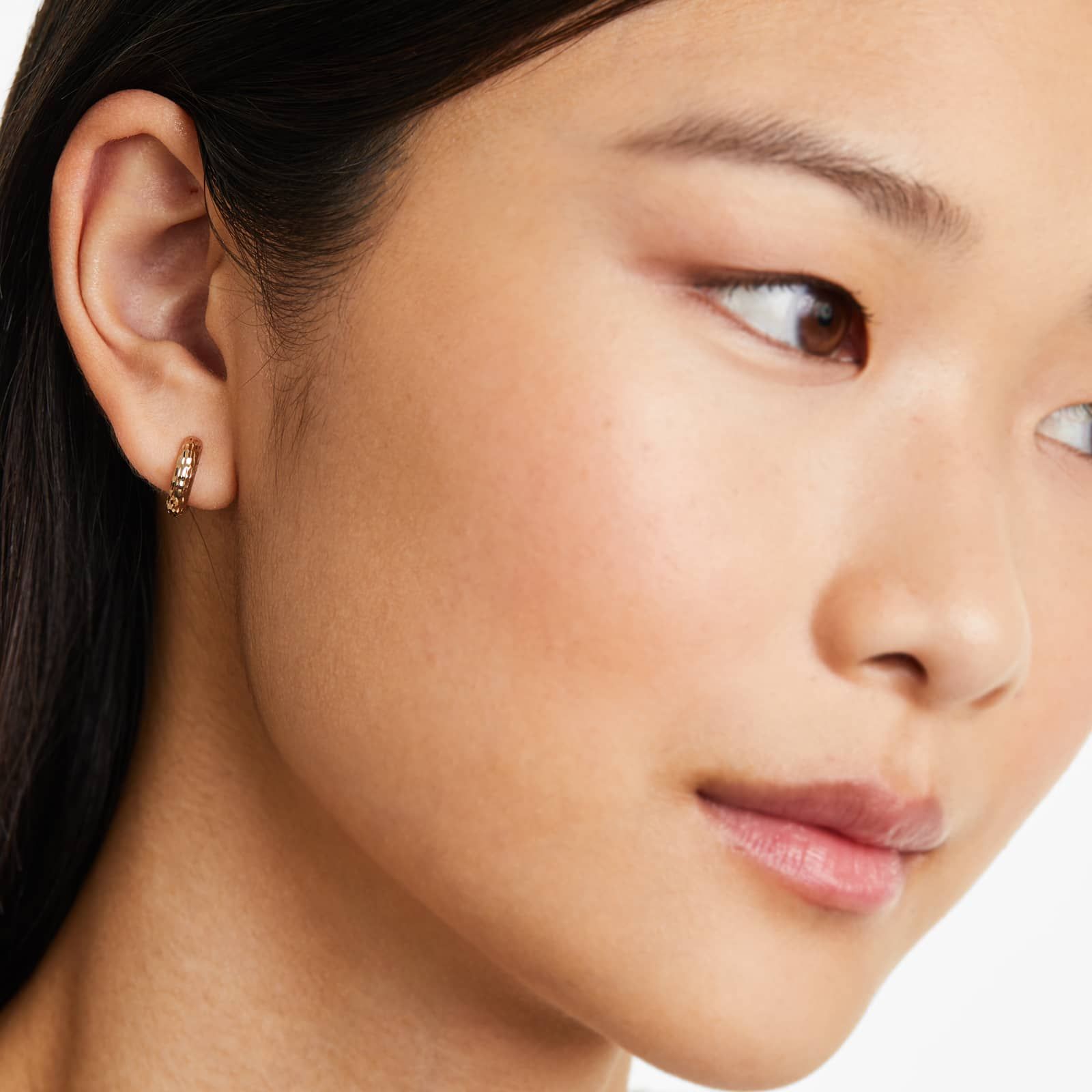 Faceted Huggie Hoop Earrings In 14K Yellow Gold