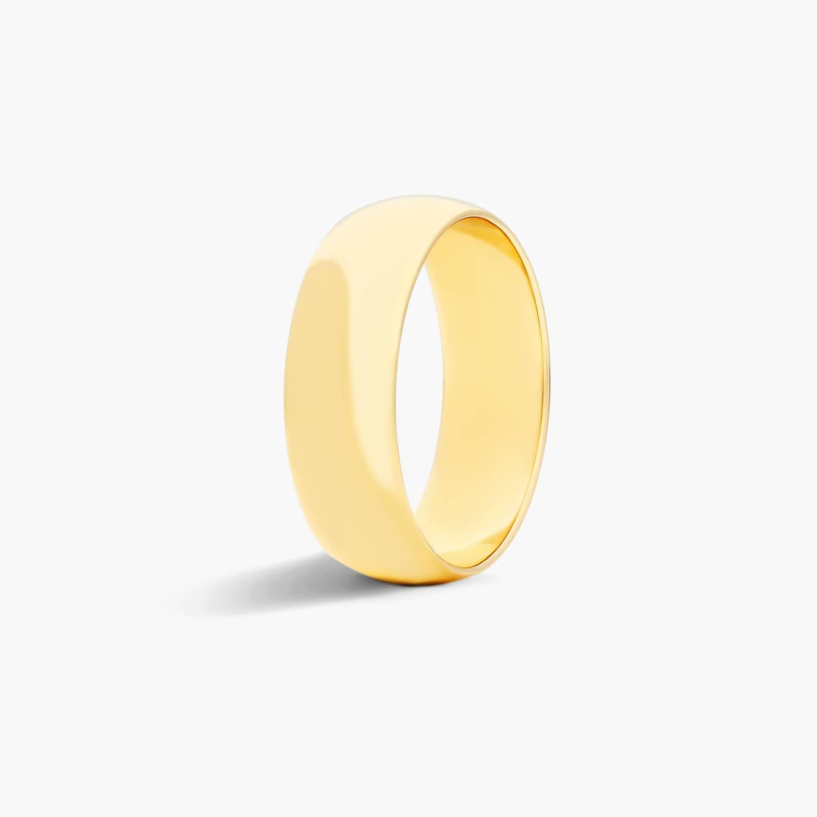 Traditional Slightly Curved Wedding Band In 14K Yellow Gold (7.00mm)
