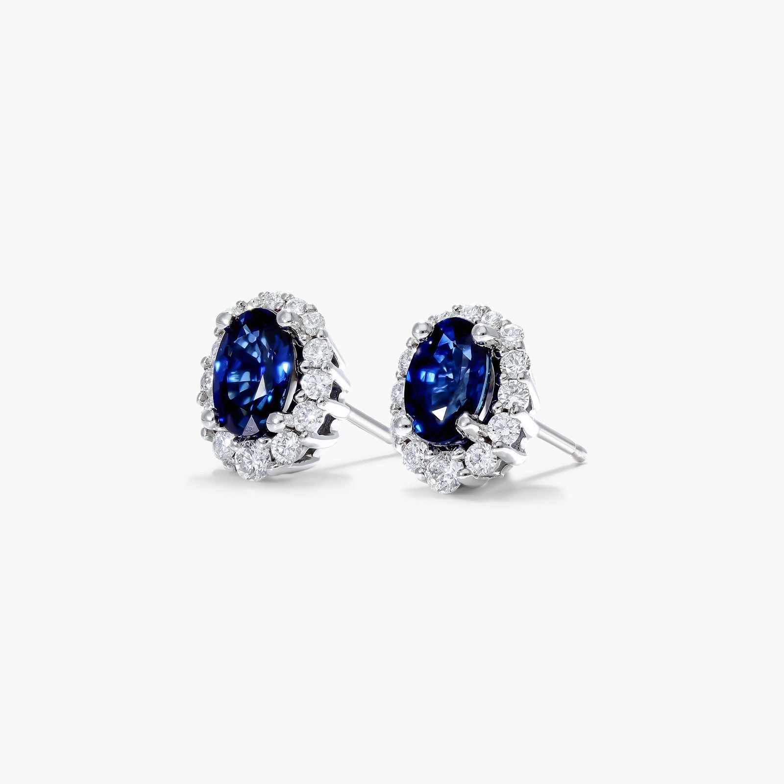 Blue Sapphire And Diamond Halo Earrings In 14K White Gold