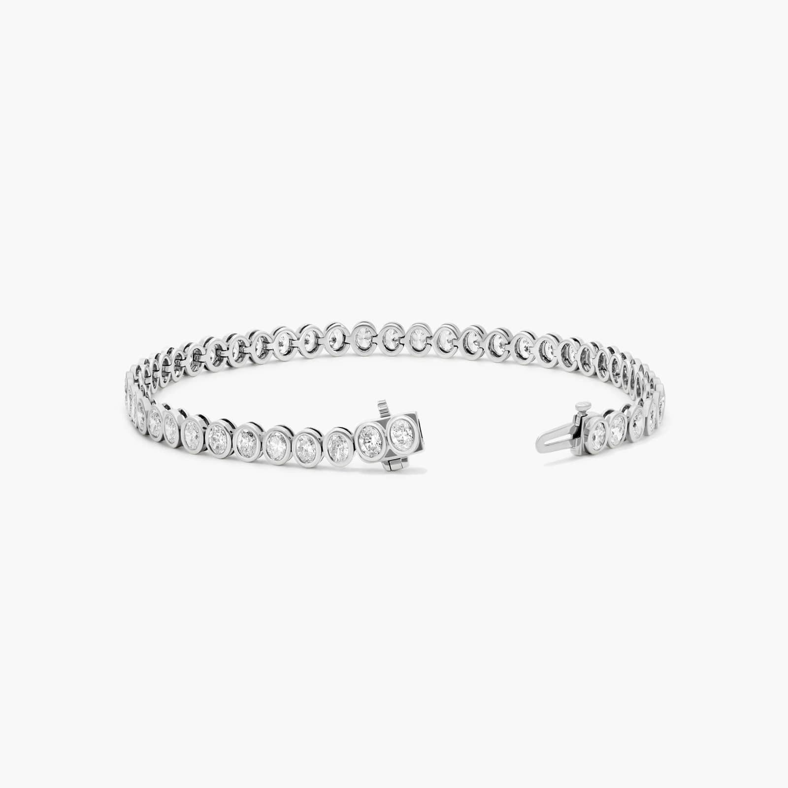 Bezel Tennis Bracelet With Oval Cut Diamonds In 14K White Gold